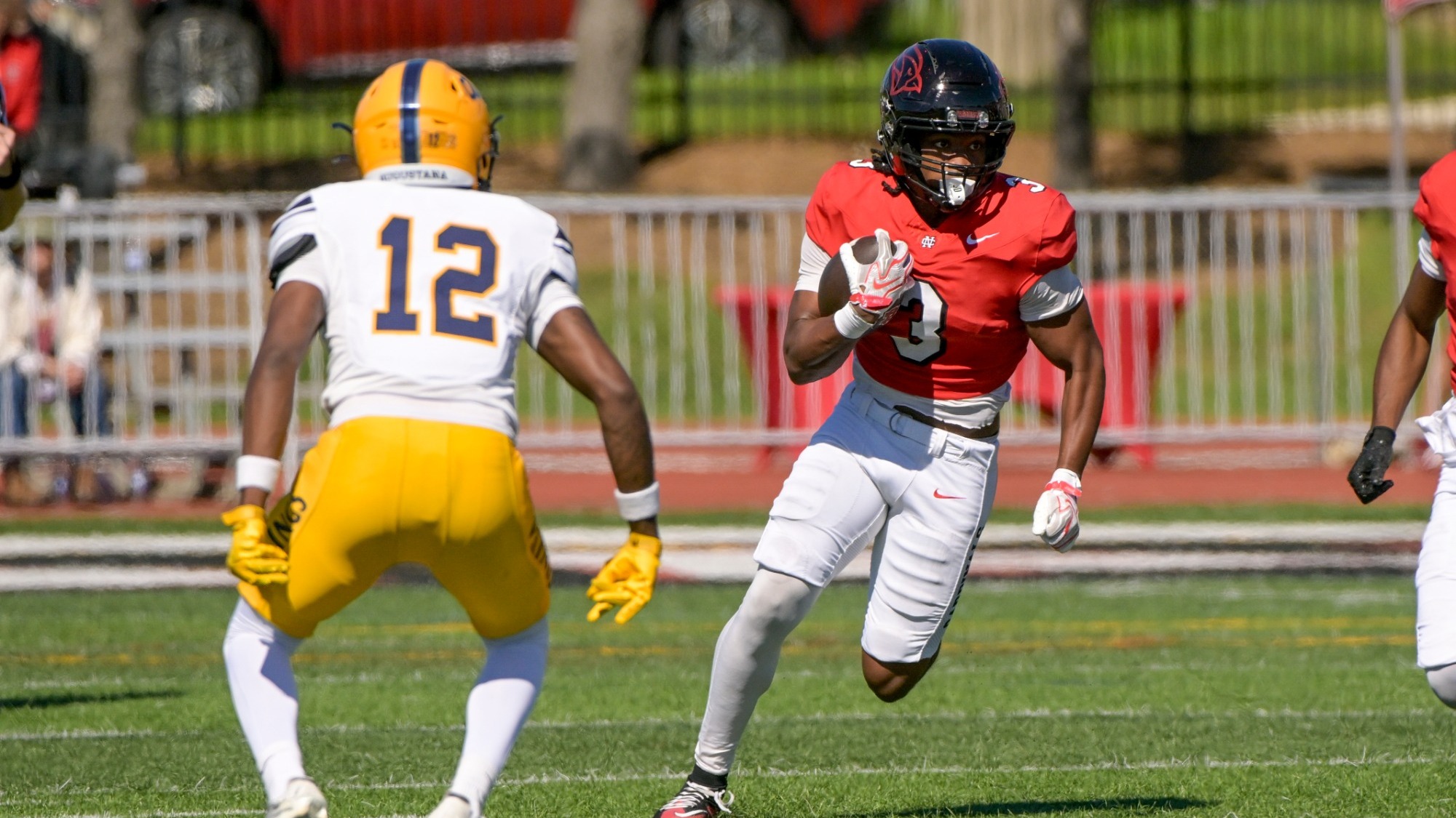 Jordan Williams running with the football vs Augustana