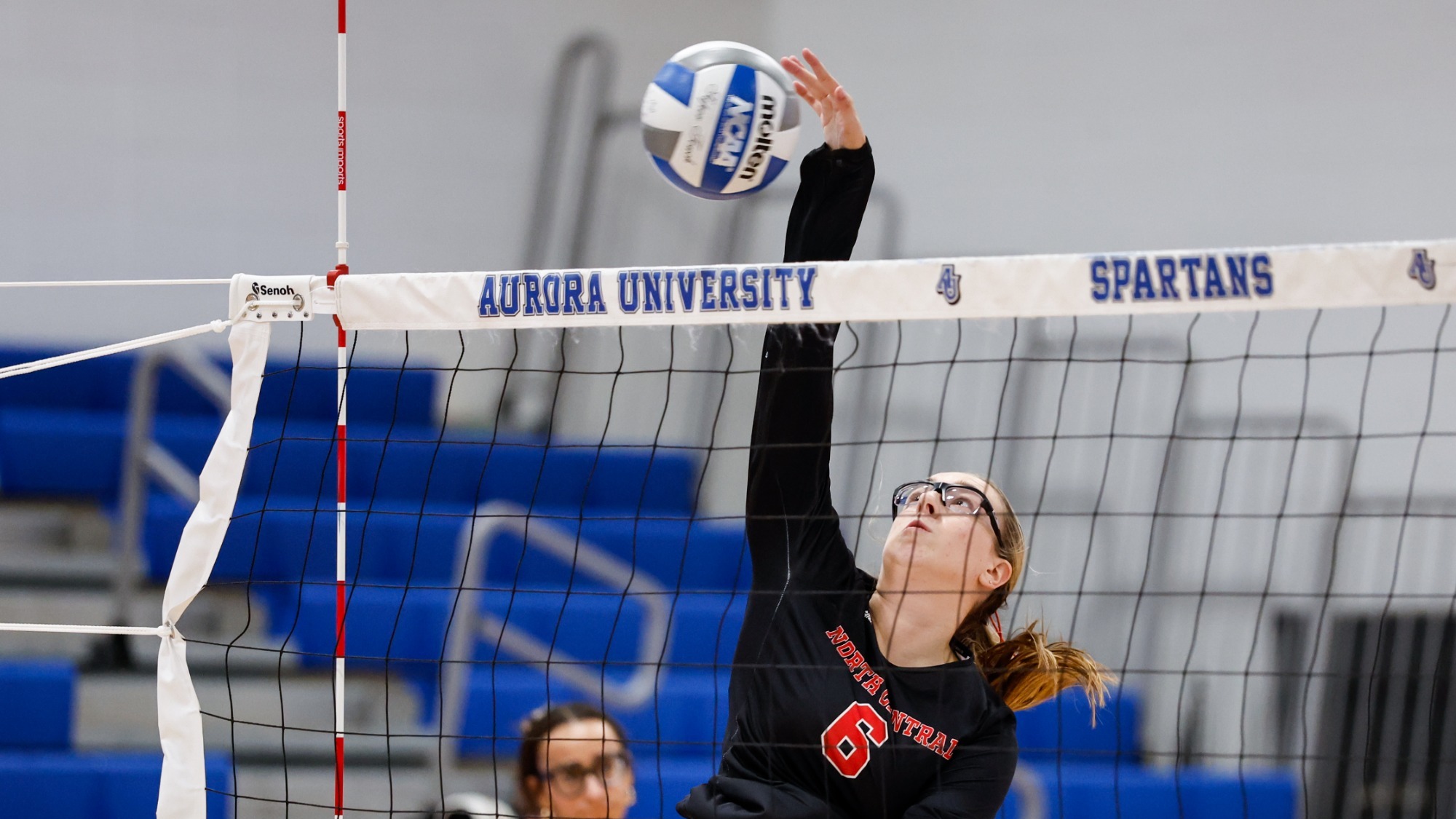 Giada Schrmenti spikes the ball over the net