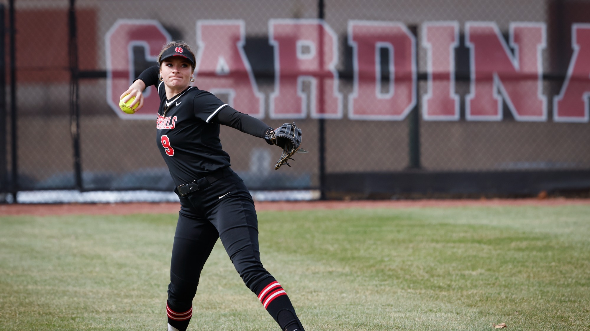Carly Creeth throwing the ball back to the infield