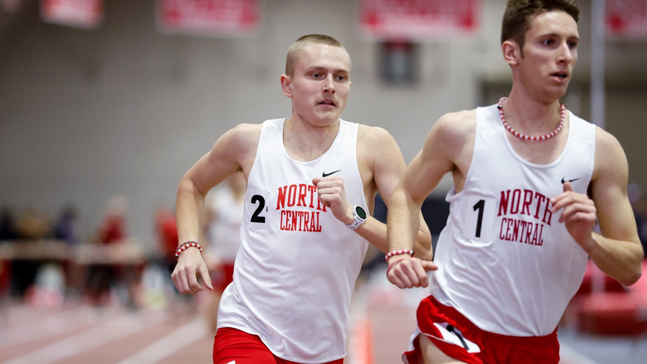 BJ Sorg runs behind teammate in a one mile race.