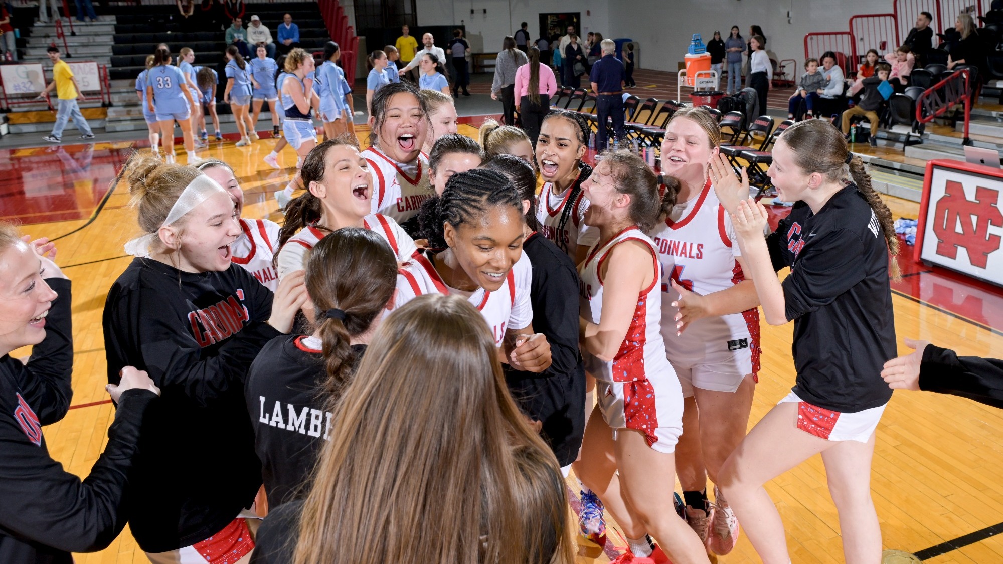The North Central College women's basketball team celebrating their last second game-winner against Elmhurst University on Feb. 14, 2026.