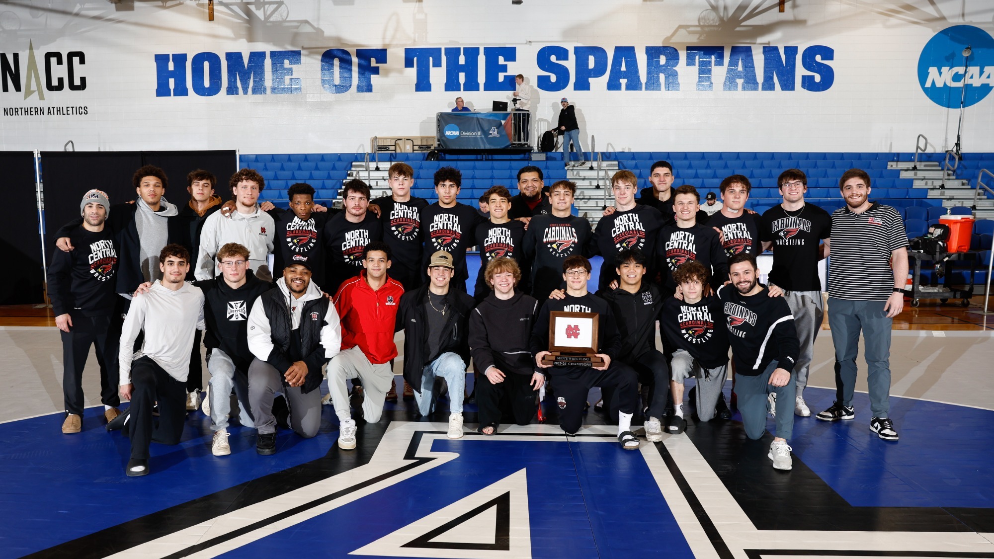 North Central Men's Wrestling Team Posing With CCIW Championship Trophy