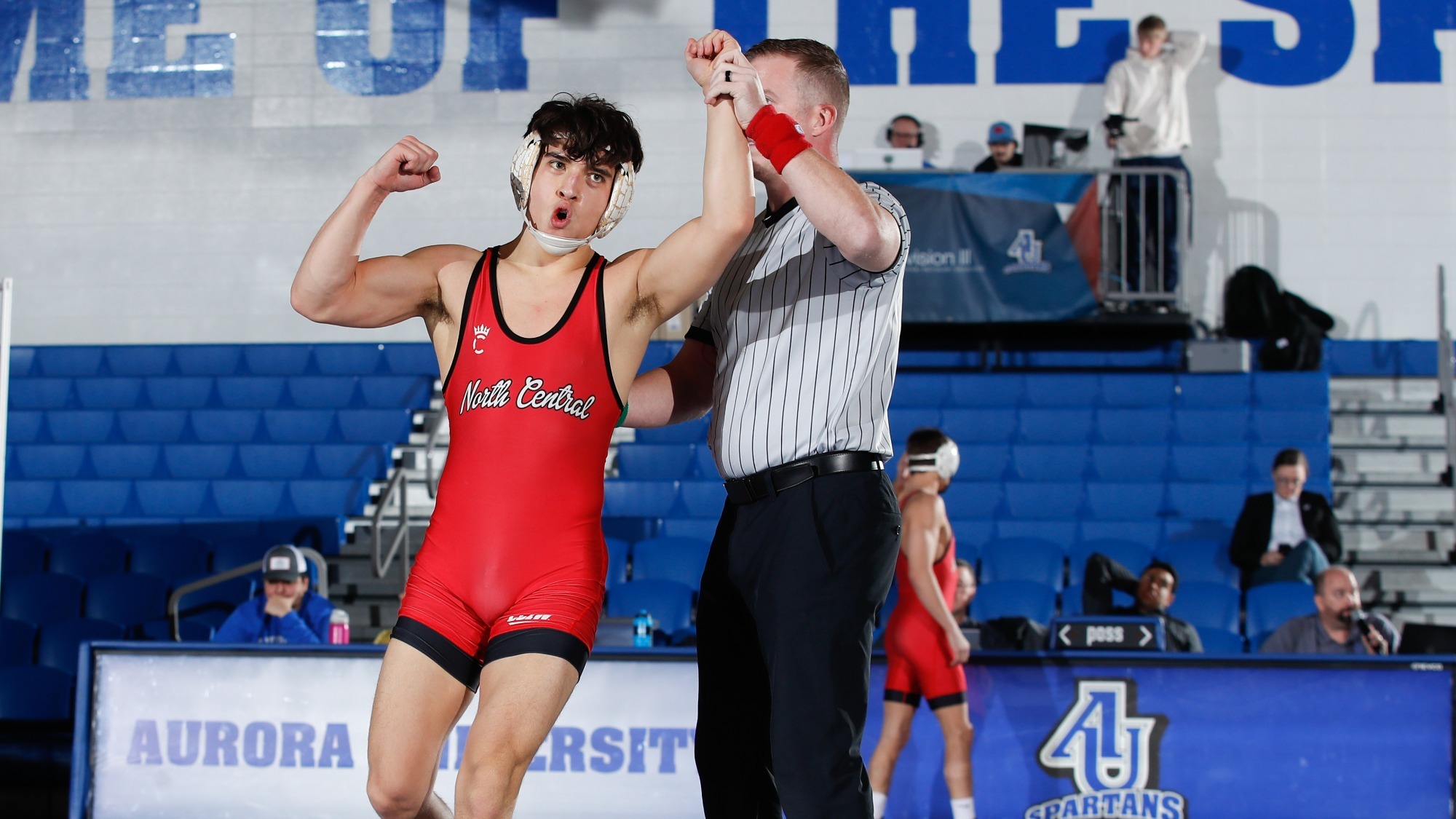 Joshua Robison with hand held up after victory
