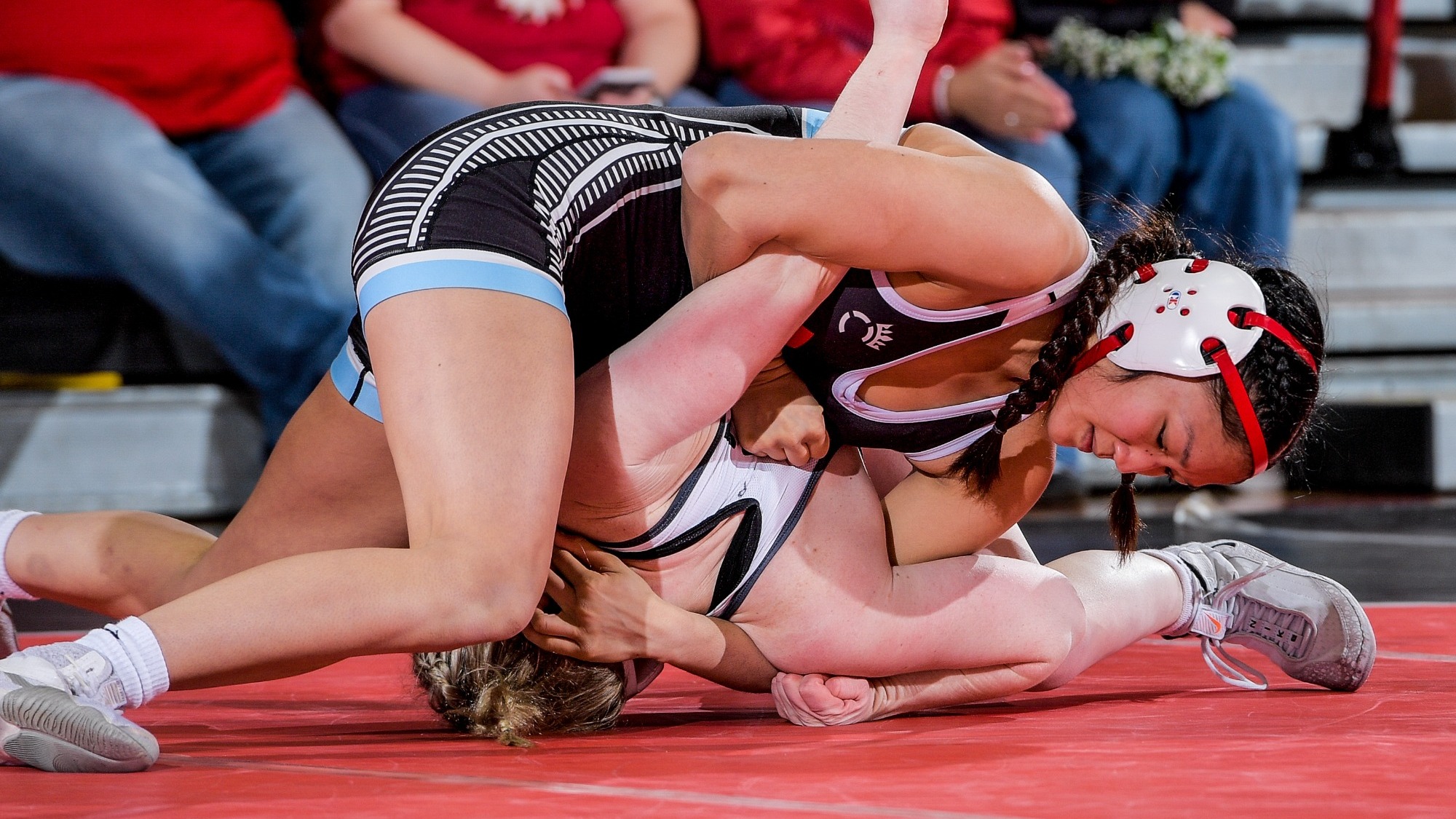 Mikayla Garcia wraps up opponent for the pin vs Wartburg