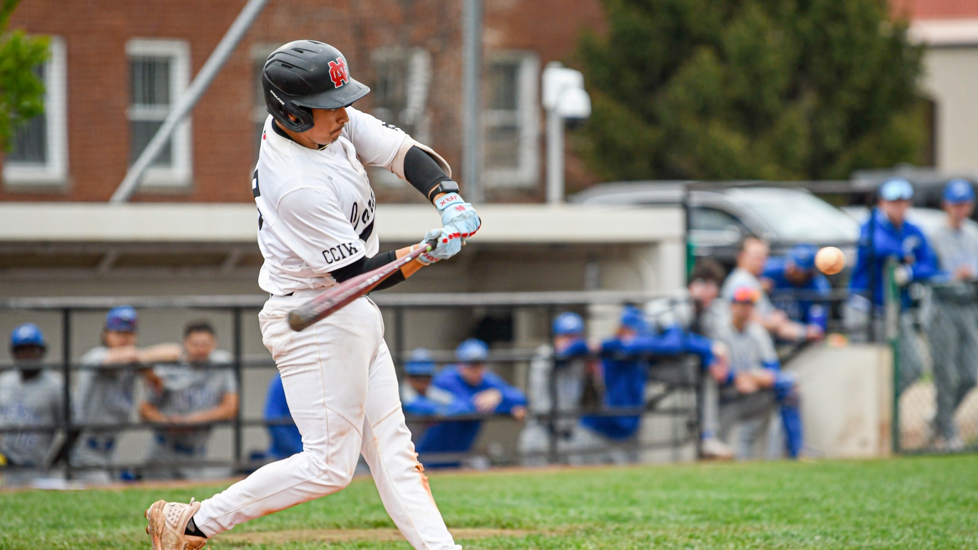 Andre Medina swinging the bat against CUW