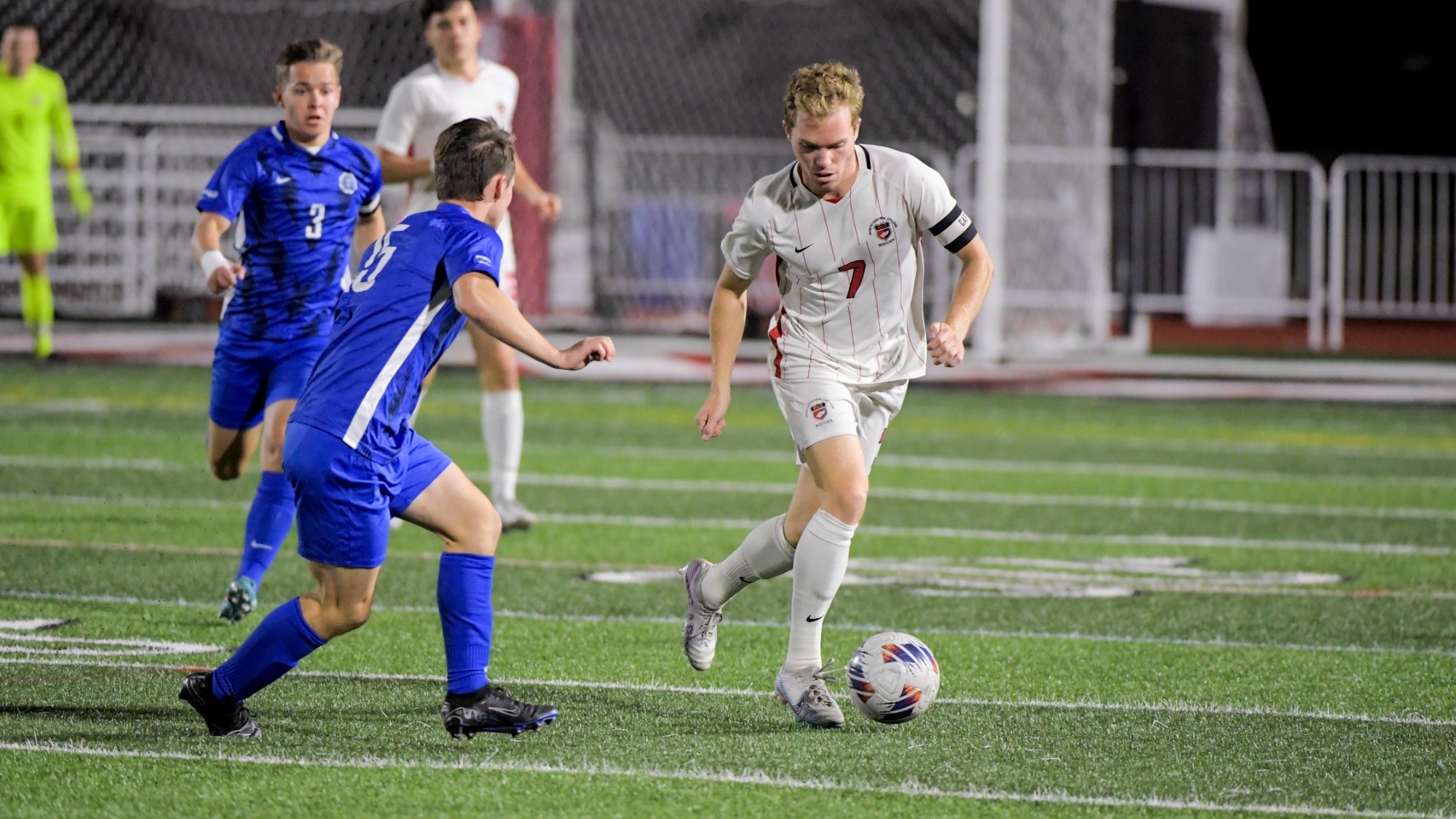 Aidan Westerberg dribbling past a Millikin defender