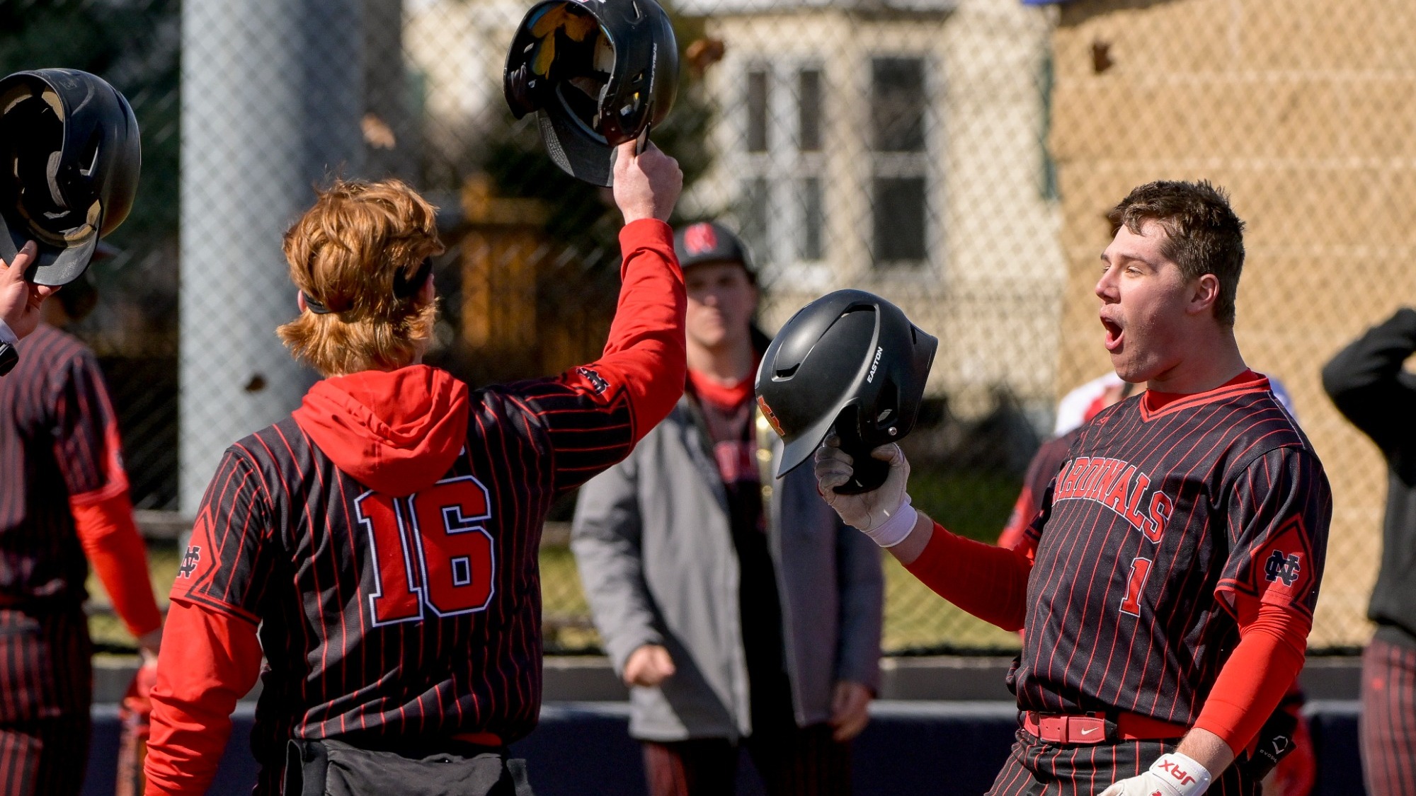 Caleb Coberley celebrates a grand slam with teammate Jackson Bland