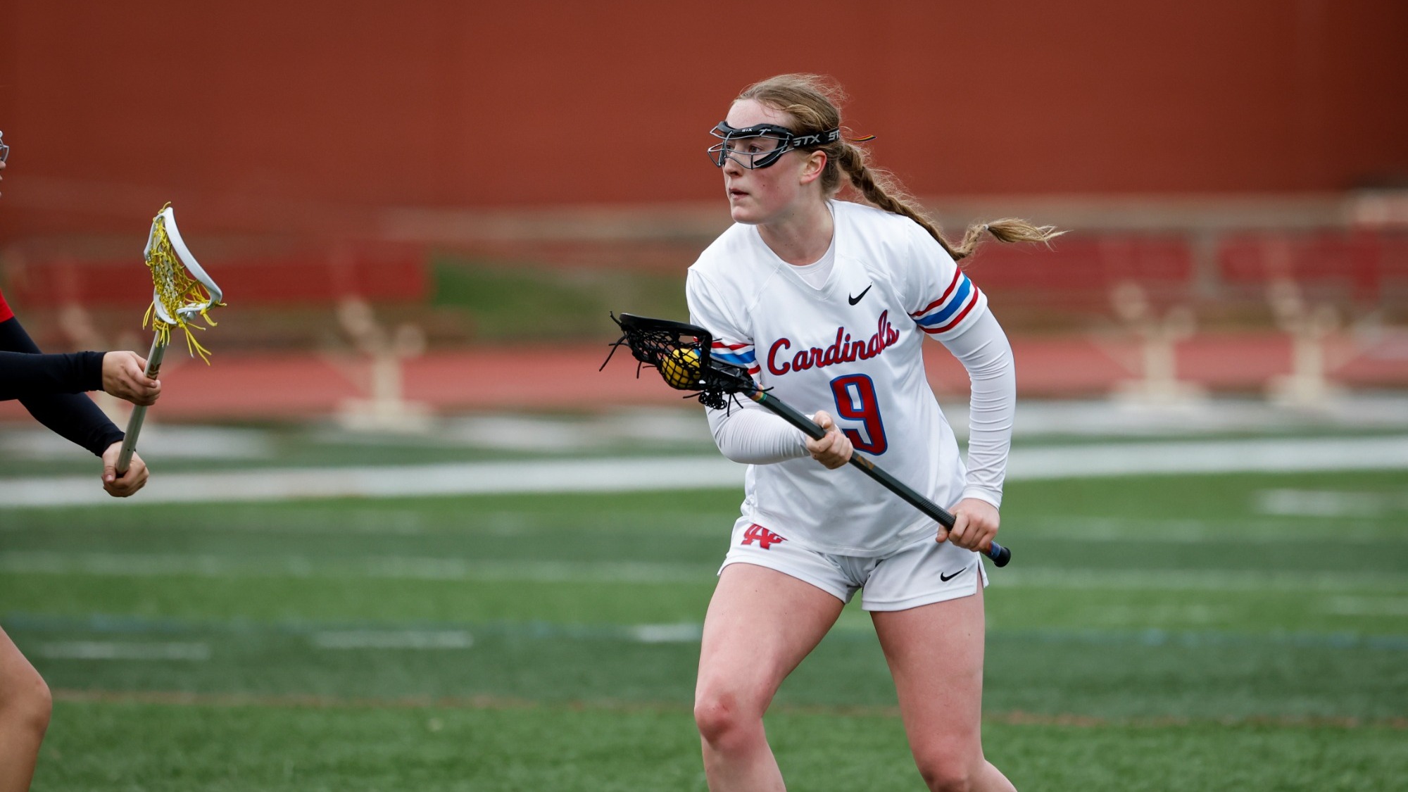 Samantha Alis carrying the ball in the North Central College women's lacrosse game against the Illinois Institute of Technology on Mar. 10, 2026.