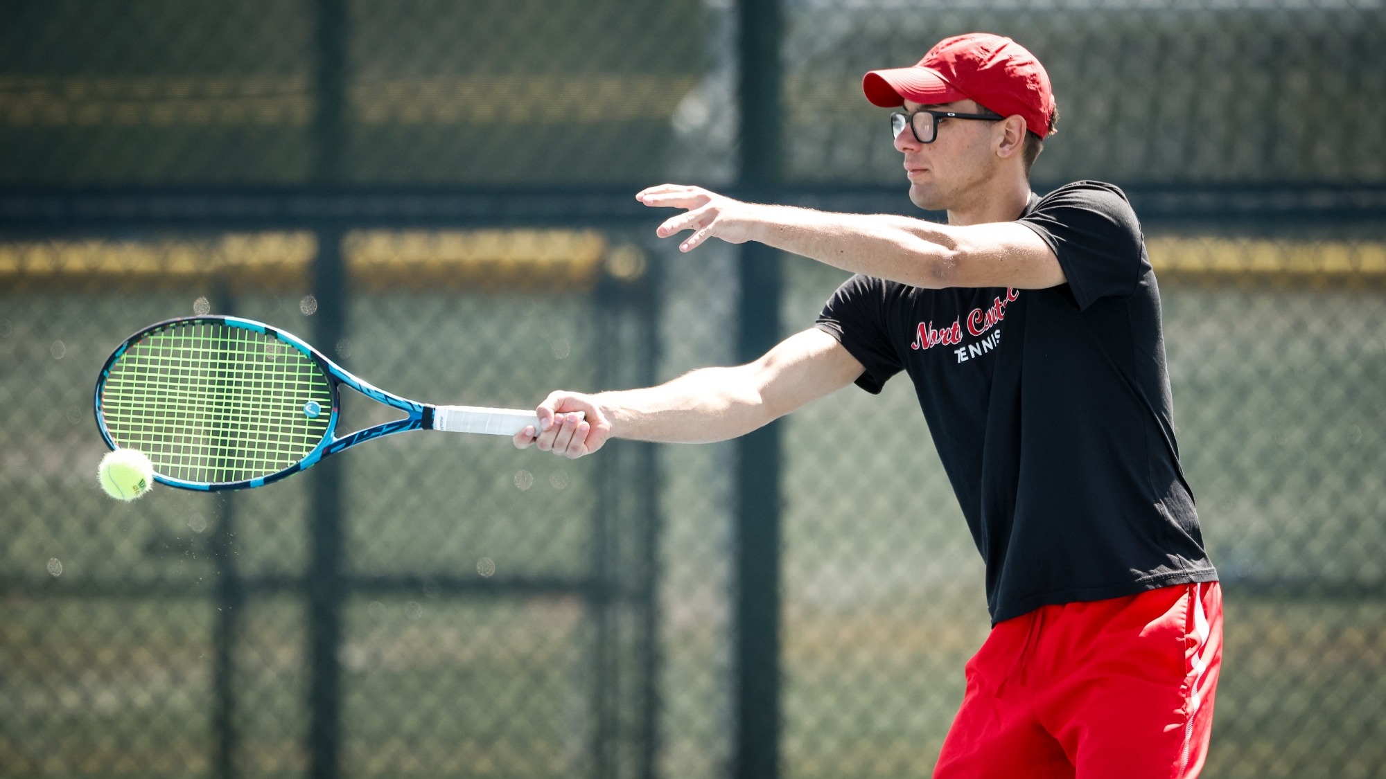 David Vilarroig Martinez returns a shot using a single handed forehand swing during a tennis match