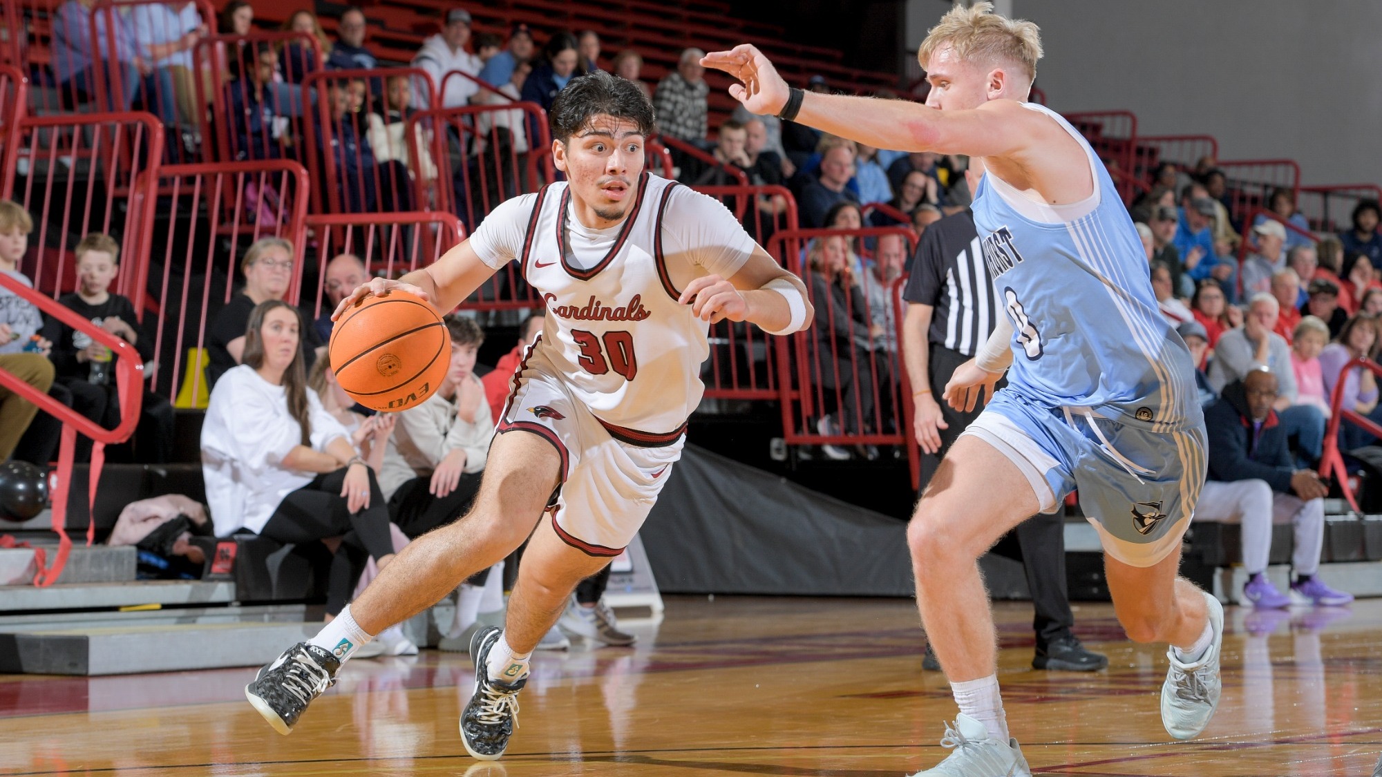 Alejandro Diaz drives past an Elmhurst defender