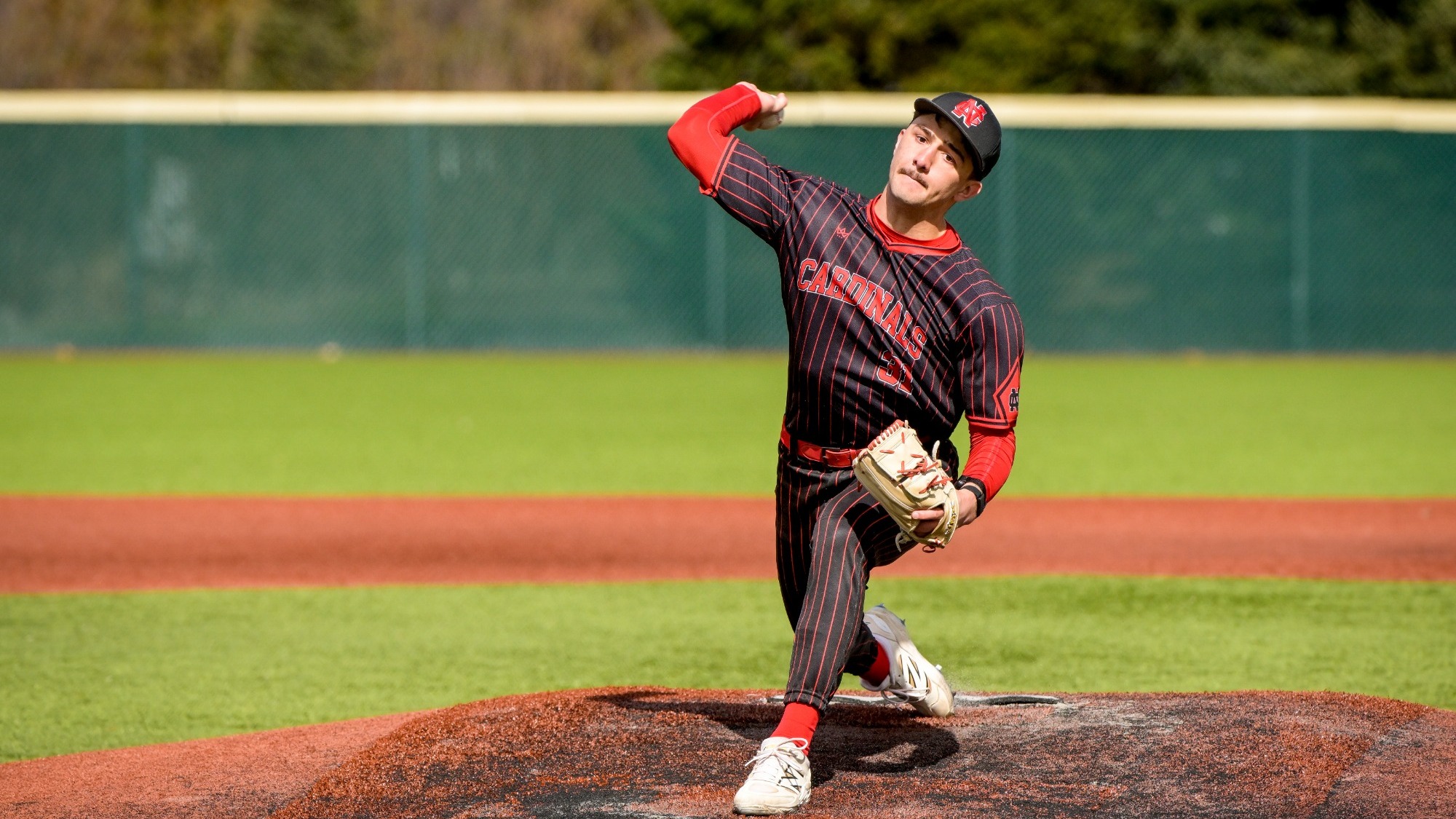 Payton Diaz throwing a pitch against Baldwin Wallace