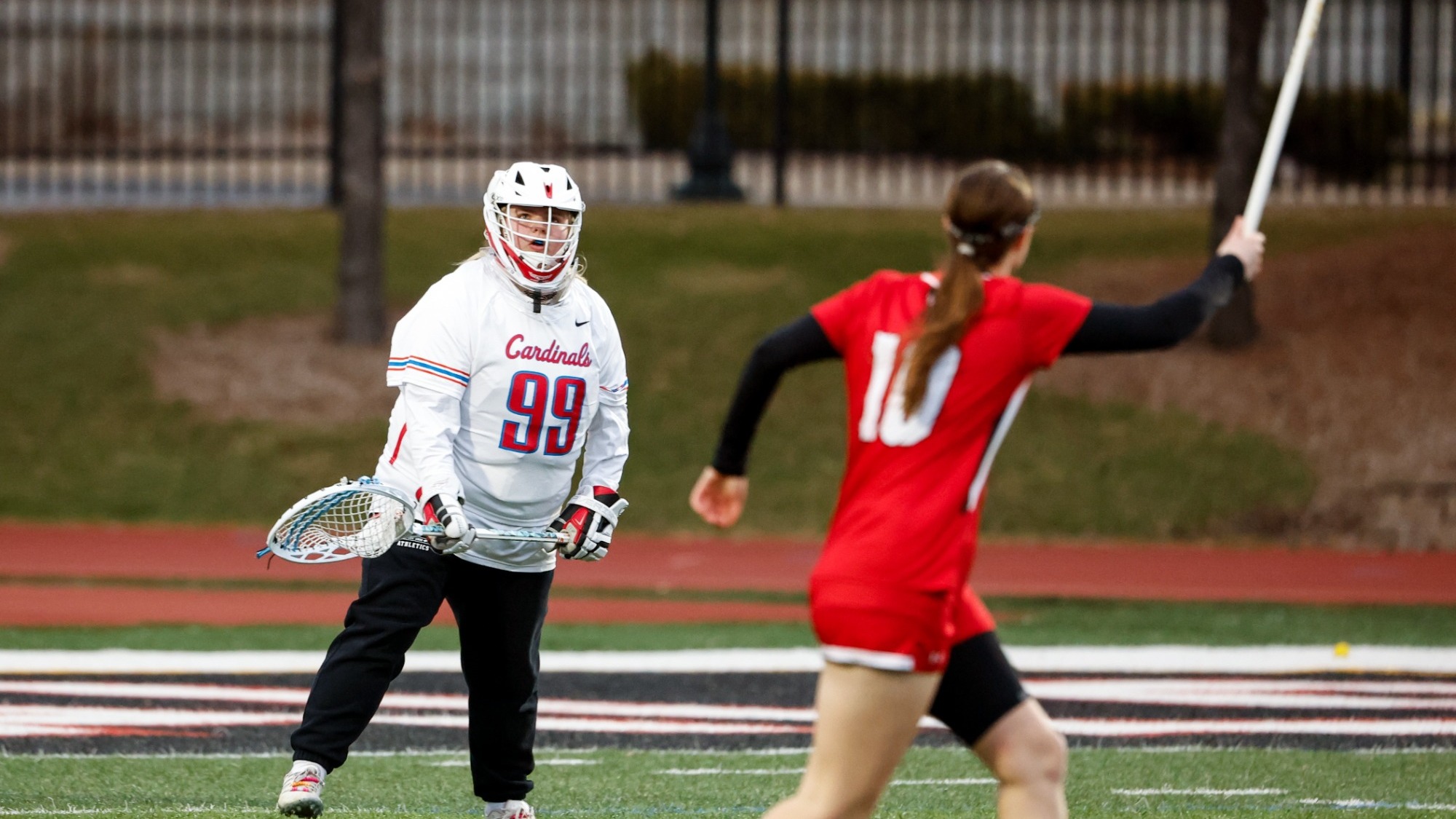 The North Central College women's lacrosse goalkeeper CC Rovik passing the ball up the field in their game against Illinois Institute of Technology.
