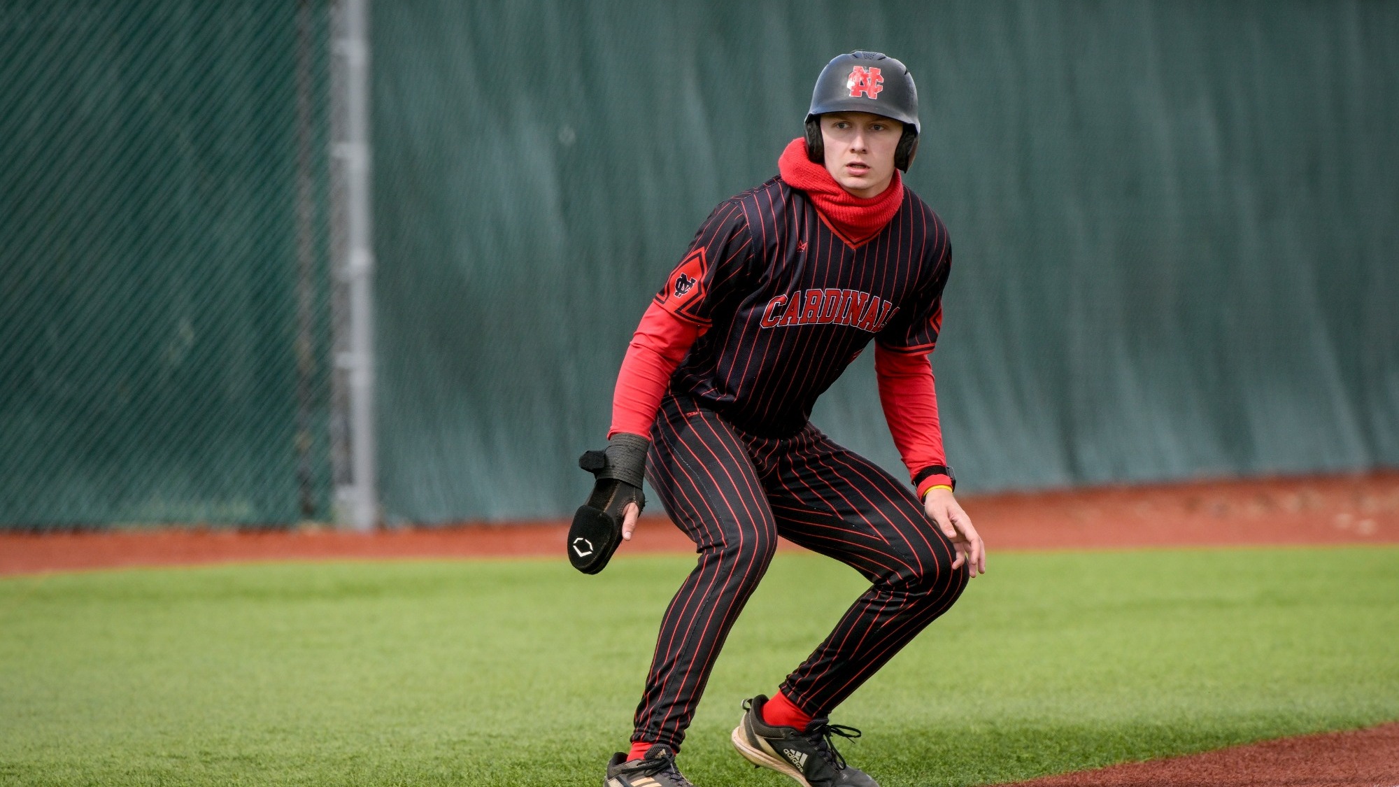Luke Wallace on third base hoping to score vs Baldwin Wallace