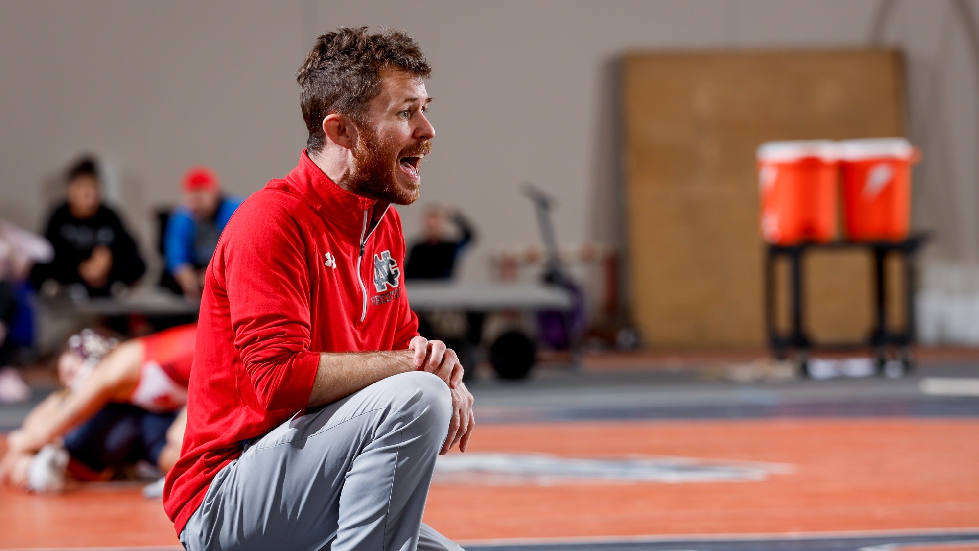 Joe Norton coaching during the North Central College Invite