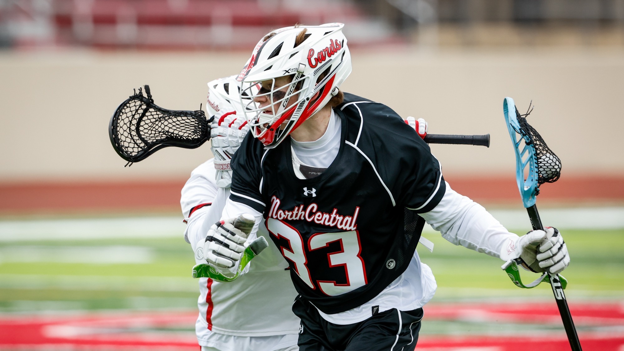 Jack Blaylock trying to lose his Benedictine University defender in the North Central College men's lacrosse season opener on Feb. 27, 2026.