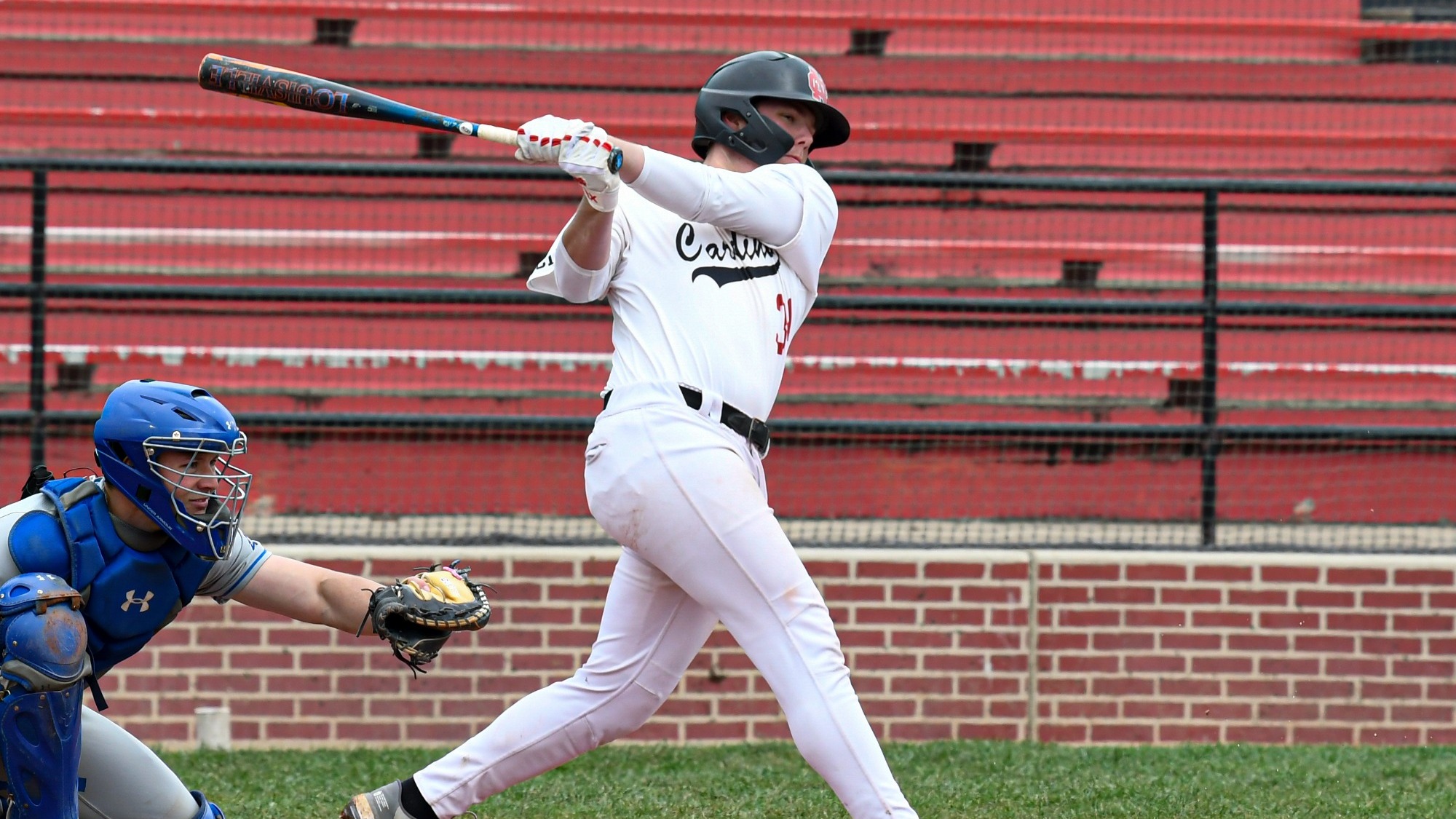 Caleb Coberley swinging the bat against CUW