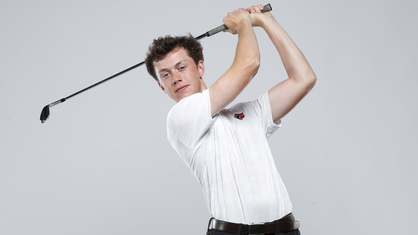 Rylan Lother swings a golf club at a promo shoot