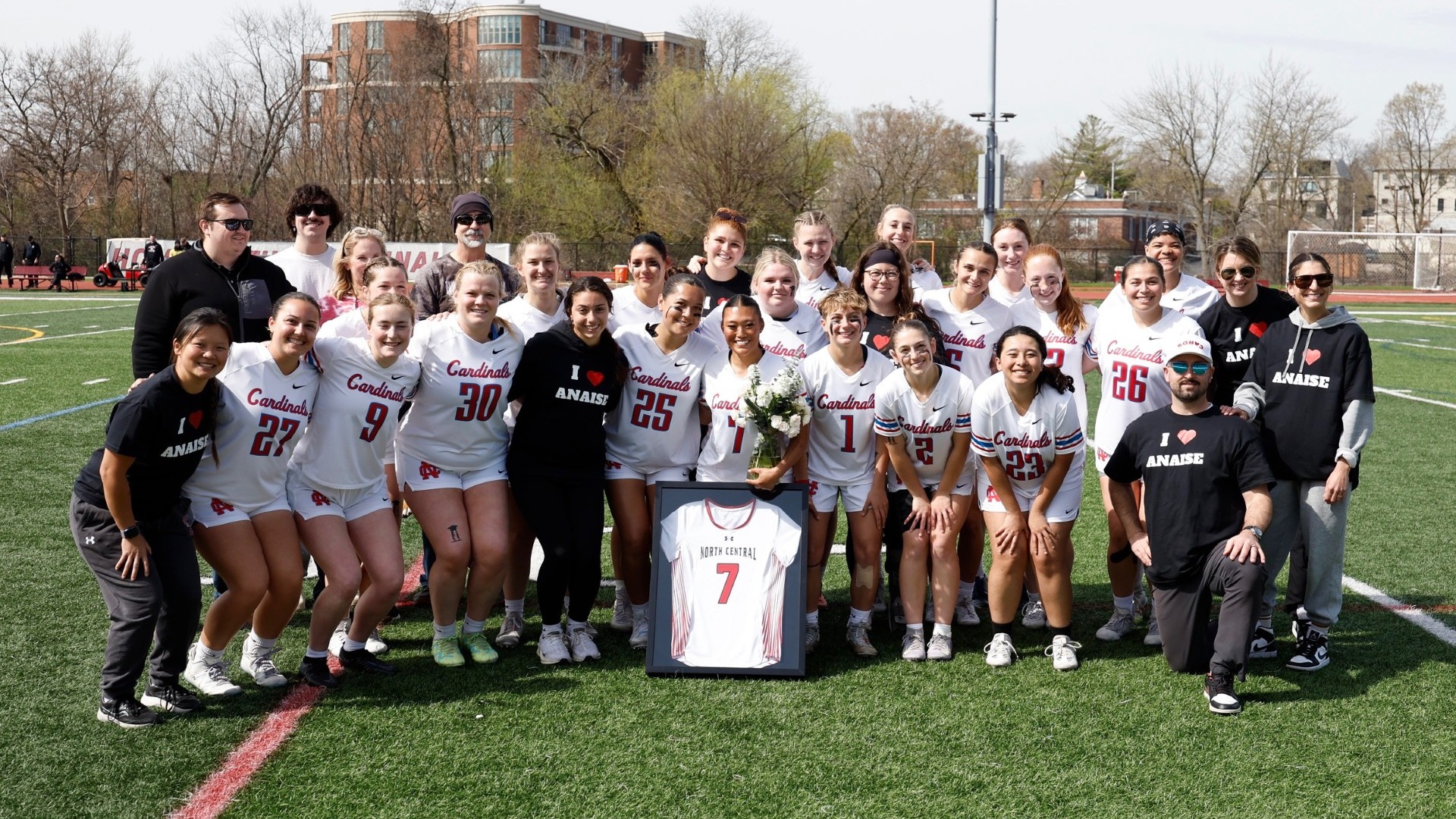 The North Central College women's lacrosse team posing with senior Anaise Kaufman before their CCIW matchup against Carthage College on Apr. 11, 2026.