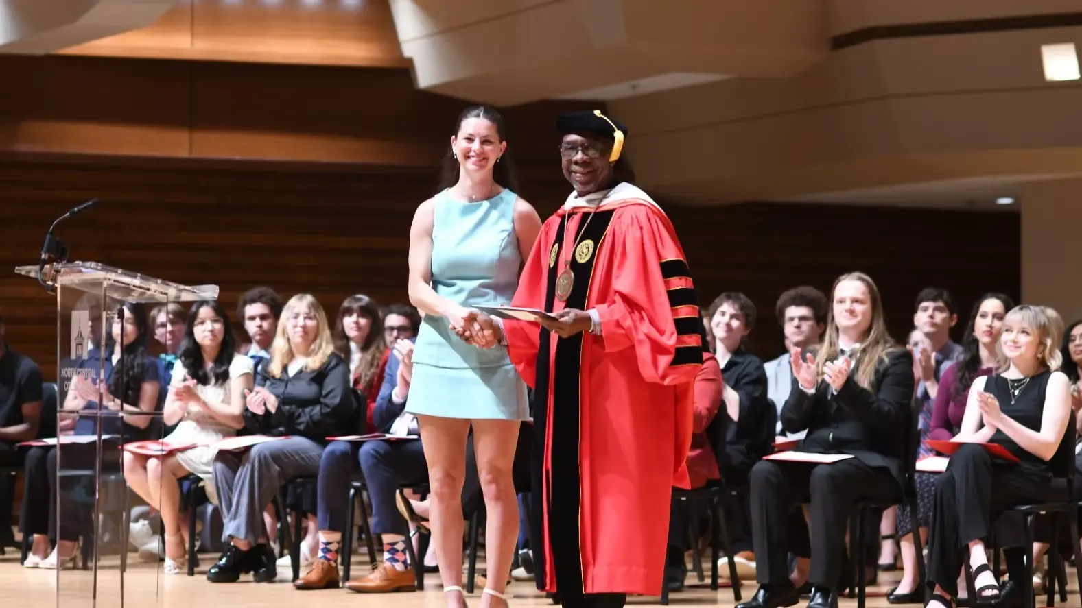 President G-P presenting women's track & field's Macy Fleury with Outstanding Senior Award