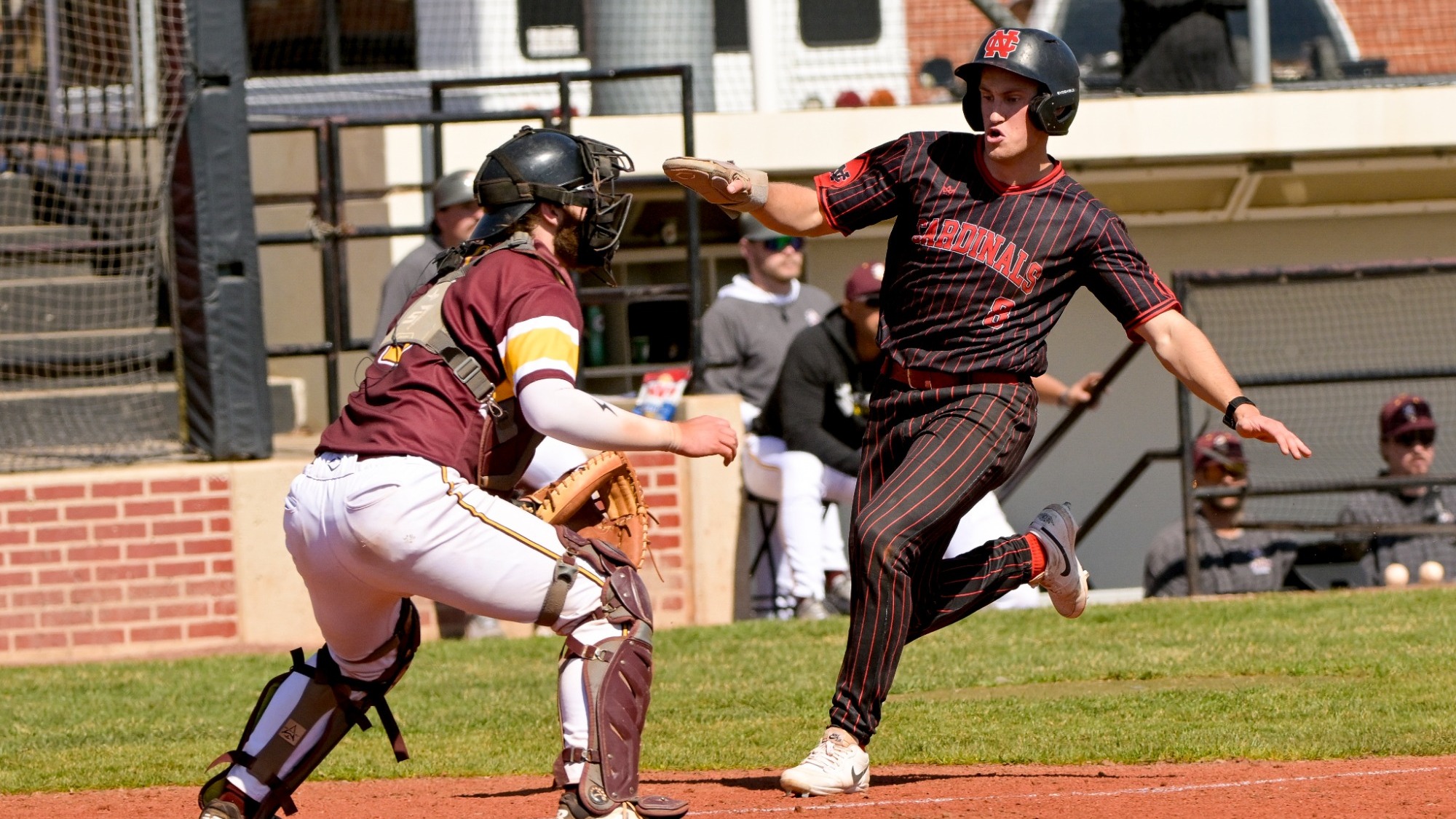 Parker Wyatt slides into home plate against Calvin