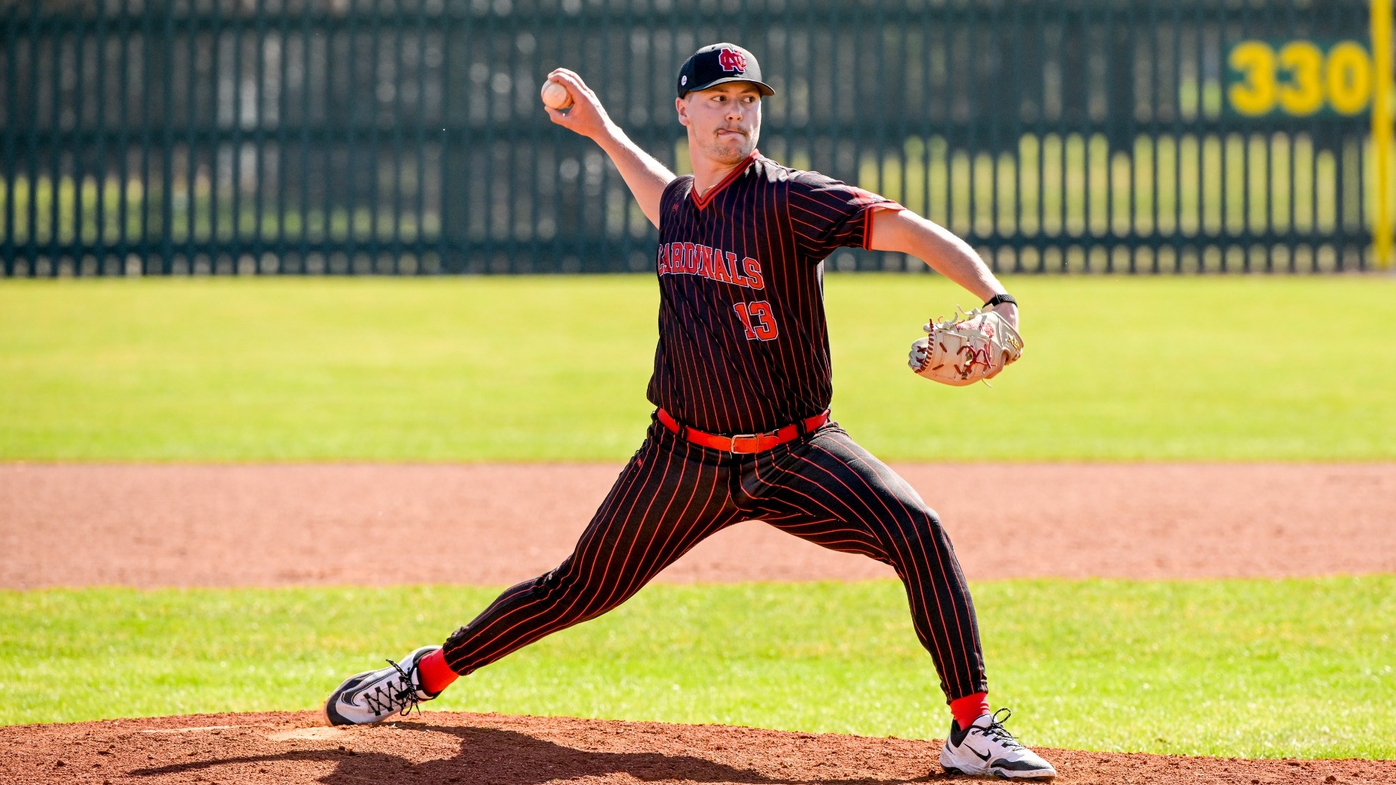 Elijah Hammond throws a fastball vs Calvin