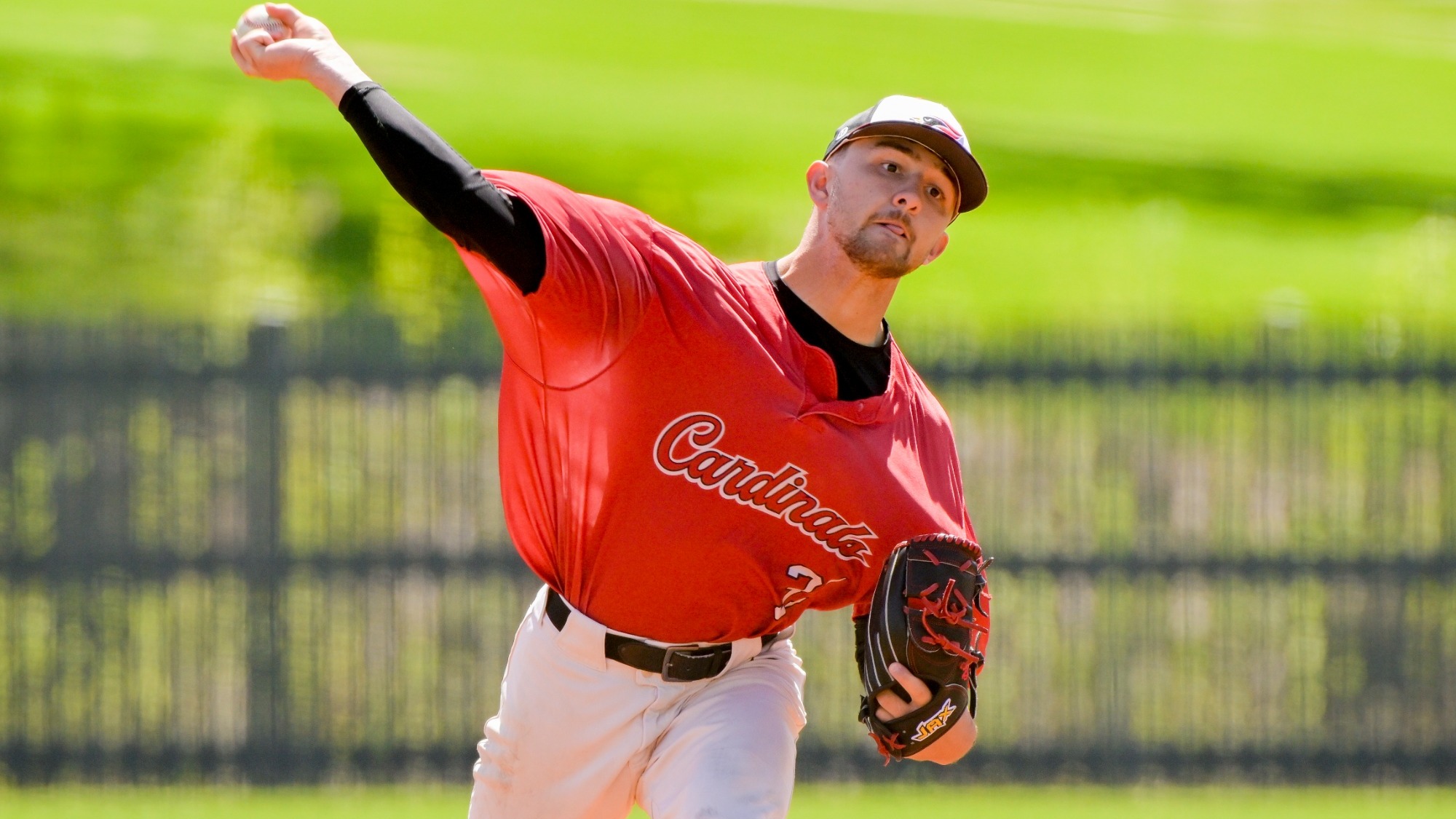 Payton Diaz delivers a pitch home during a day game against Milwaukee School of Engineering