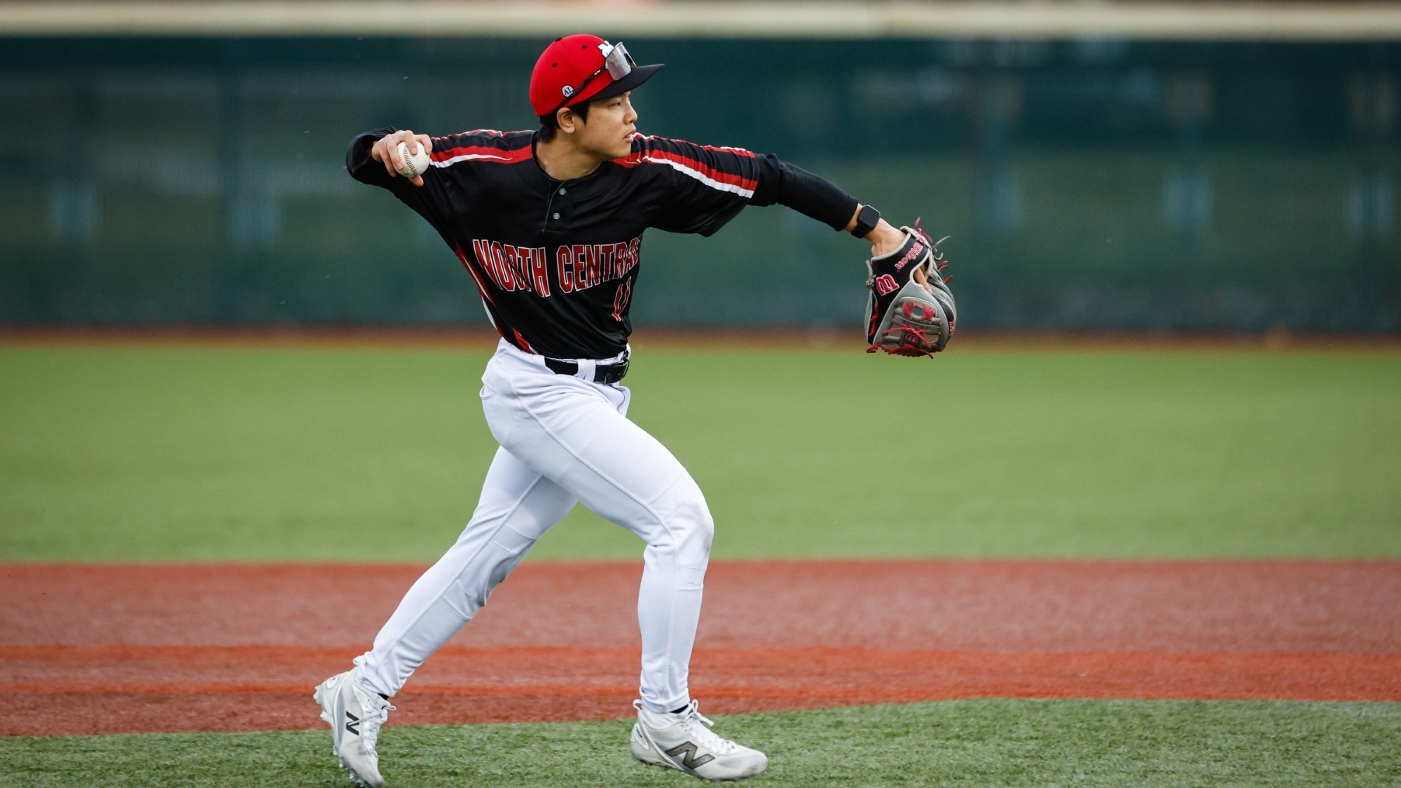 Yuhki Yamad throing the baseball to first base from short stop