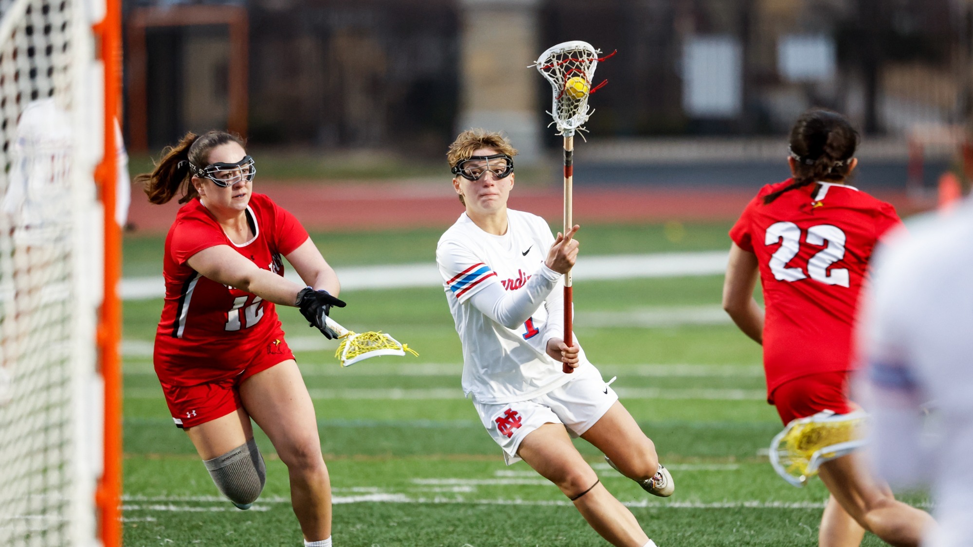 North Central College women's lacrosse player, Mikaela Busse, dodging Illinois Tech defender in their game on March 10, 2026.