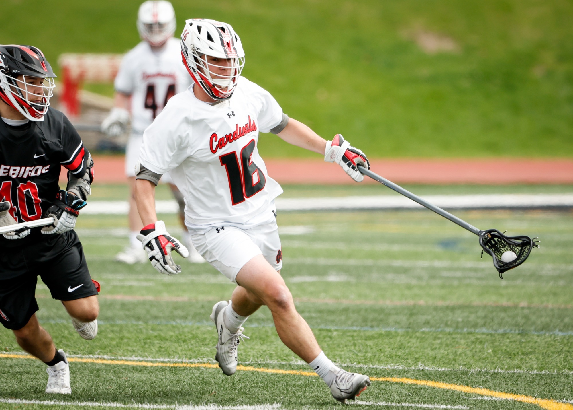 Alex Porter scoops up ground ball against Carthage