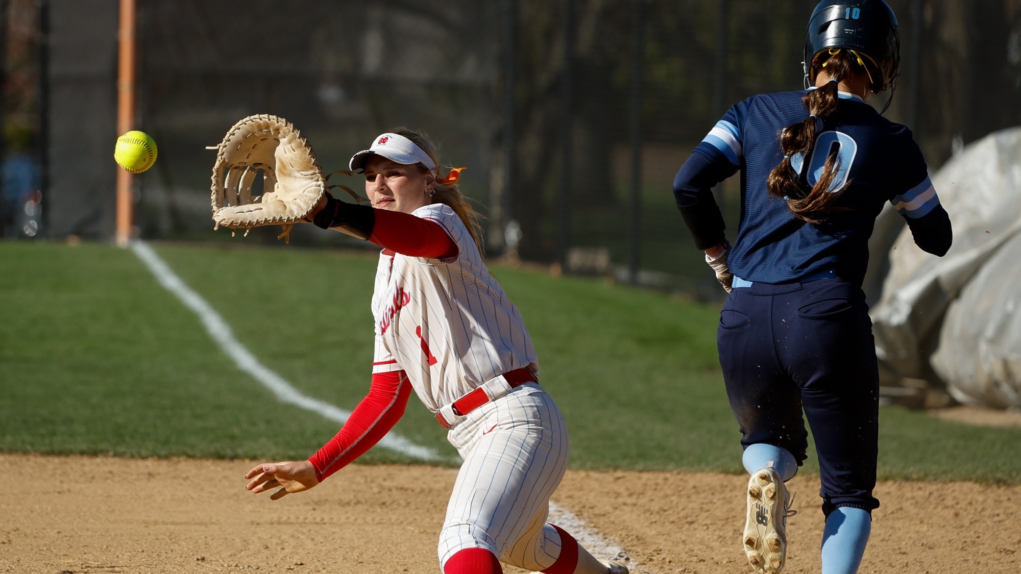 Lauren Bowmar stretches to make catch at first base