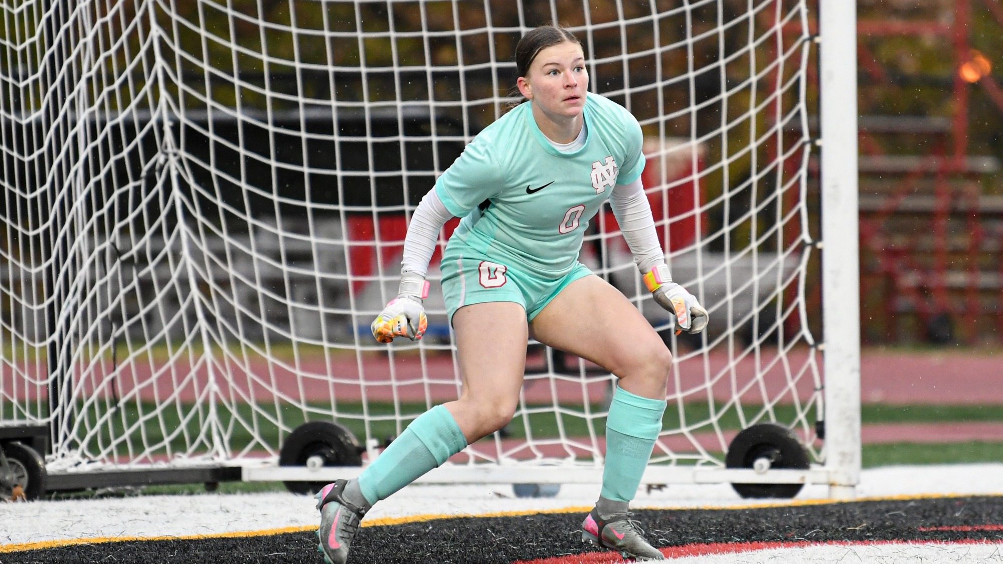 Lilly Mattison playing goalie ready to face a shot