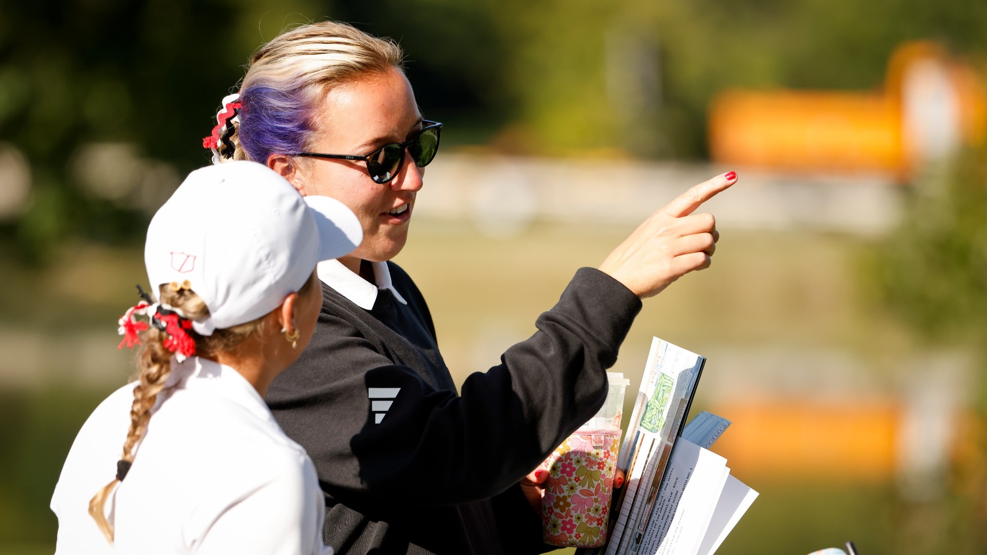 Rachel Gray Coaching Golf at the Benedictine Invite