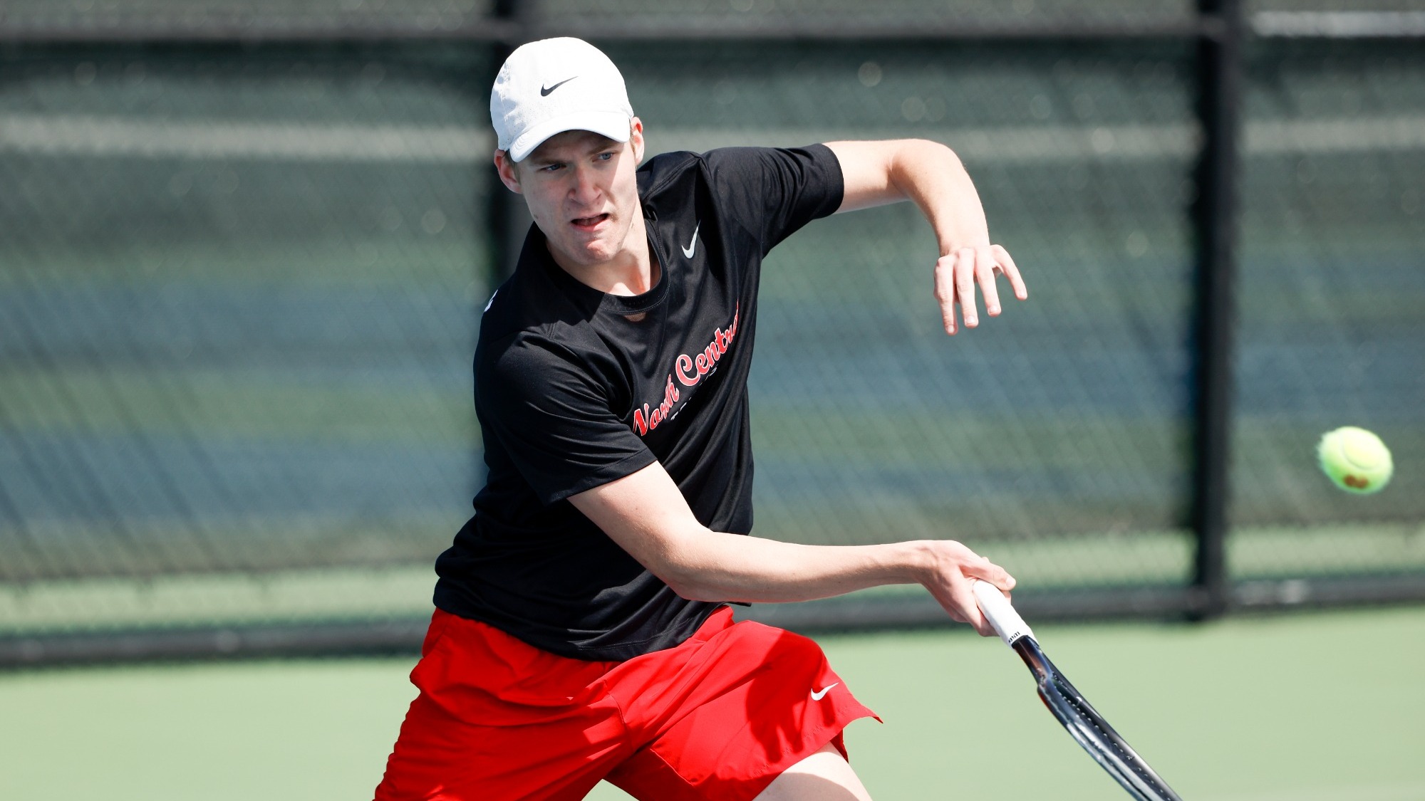 Philipp Wottgen follows through after hitting a shot during a tennis match