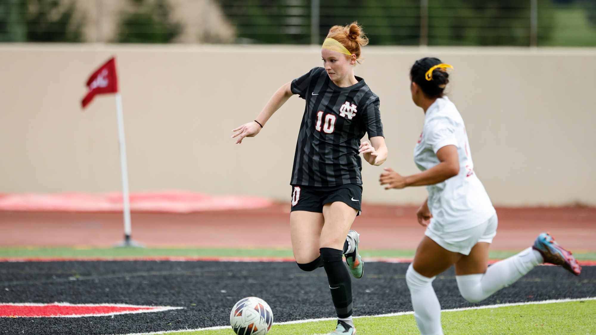 Reese Anderson Dribbling the Soccer Ball Upfield vs Benedictine