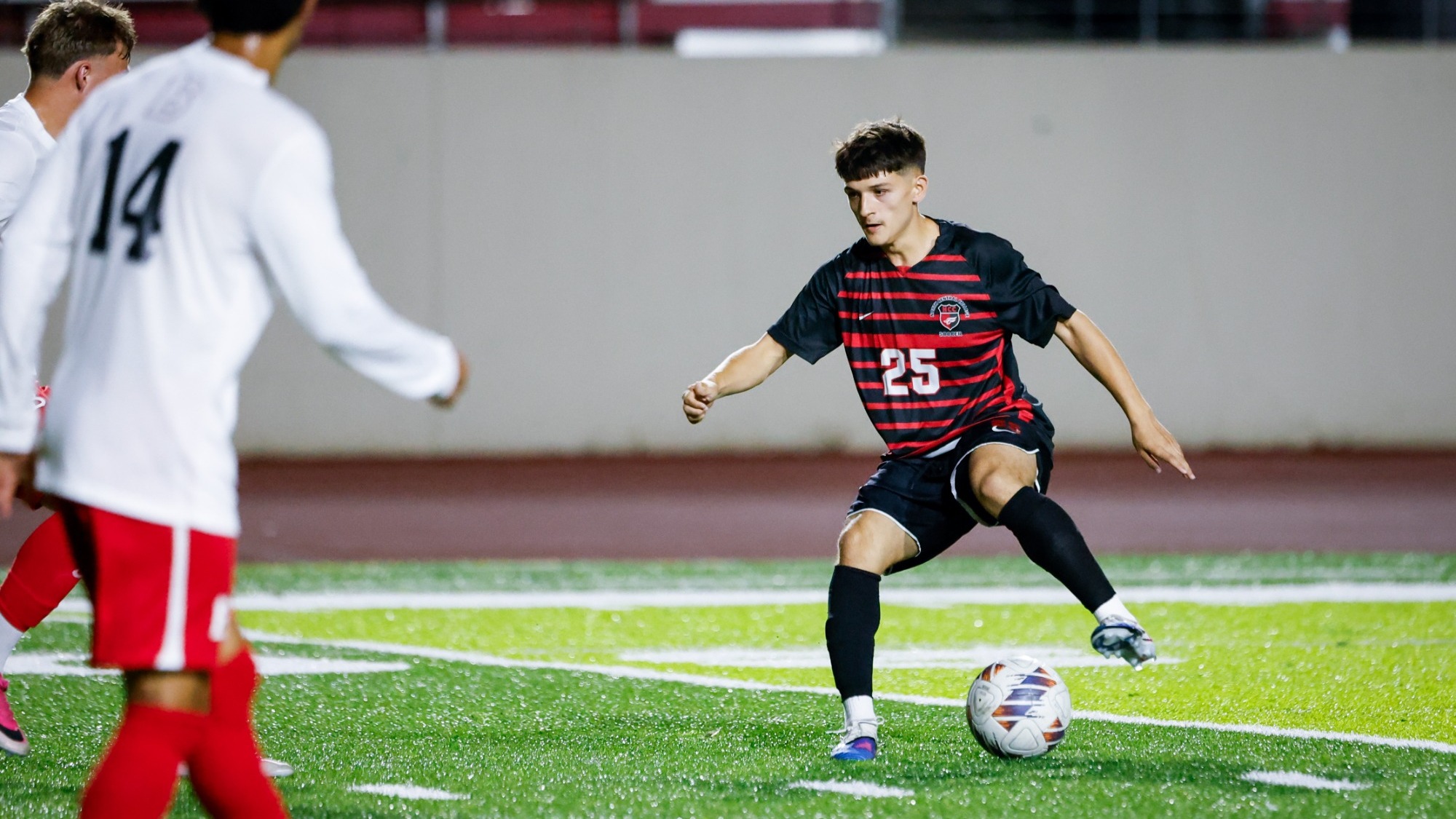 The North Central College men's soccer student-athlete Julian Nino dribbling the ball against Benedictine University on Sept. 3, 2026.