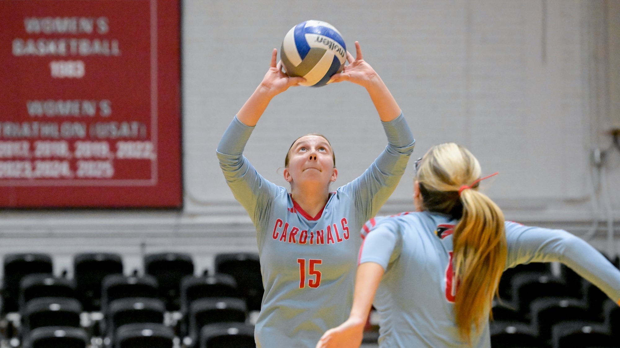 Sarah Harvey setting the volleyball to Giada Schrementi