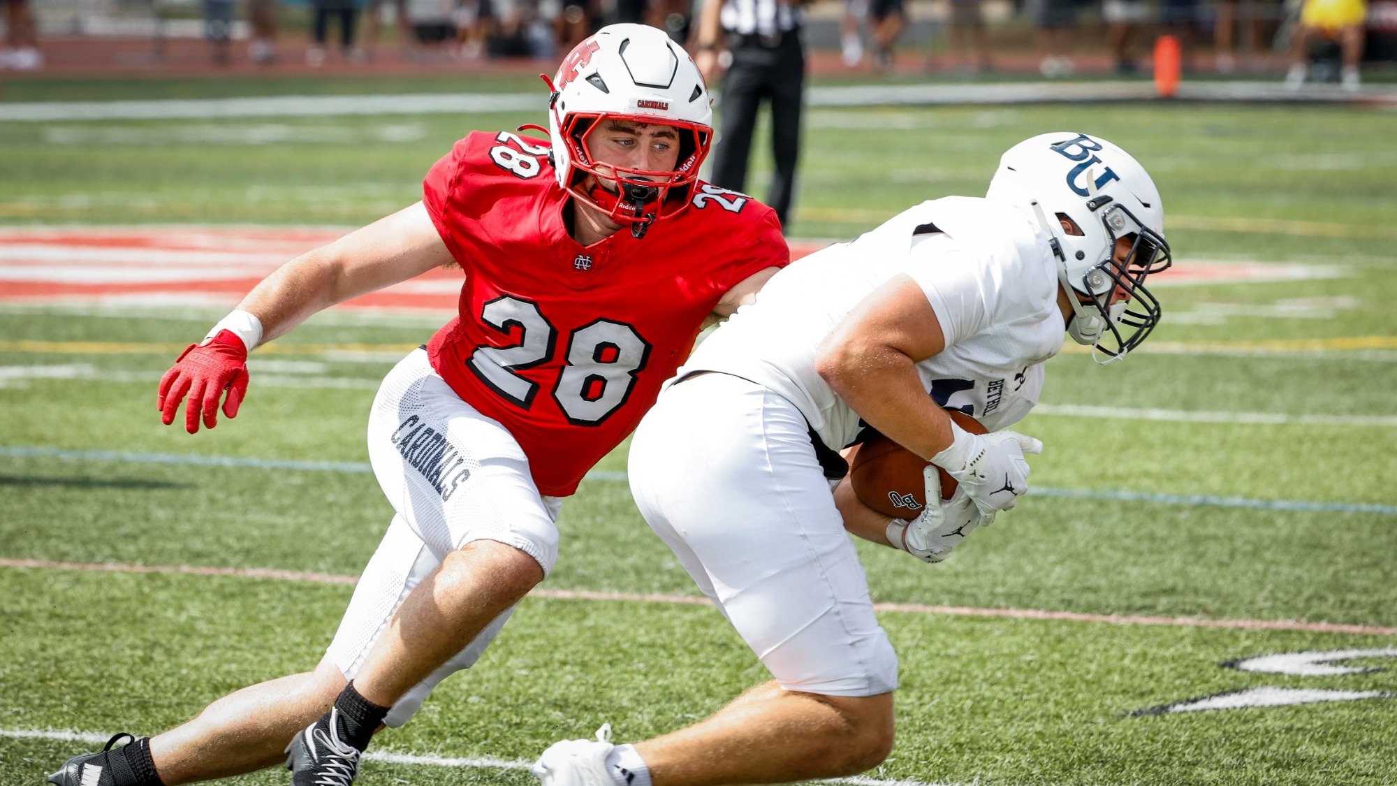 Phillip Carlton Jr. tackles a Bethel player