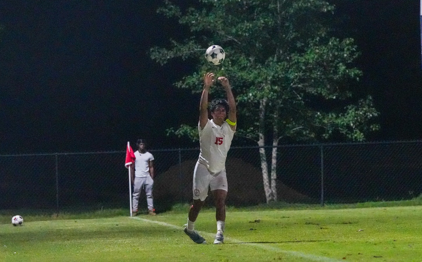 Osvaldo Macias throws in from the sidelines