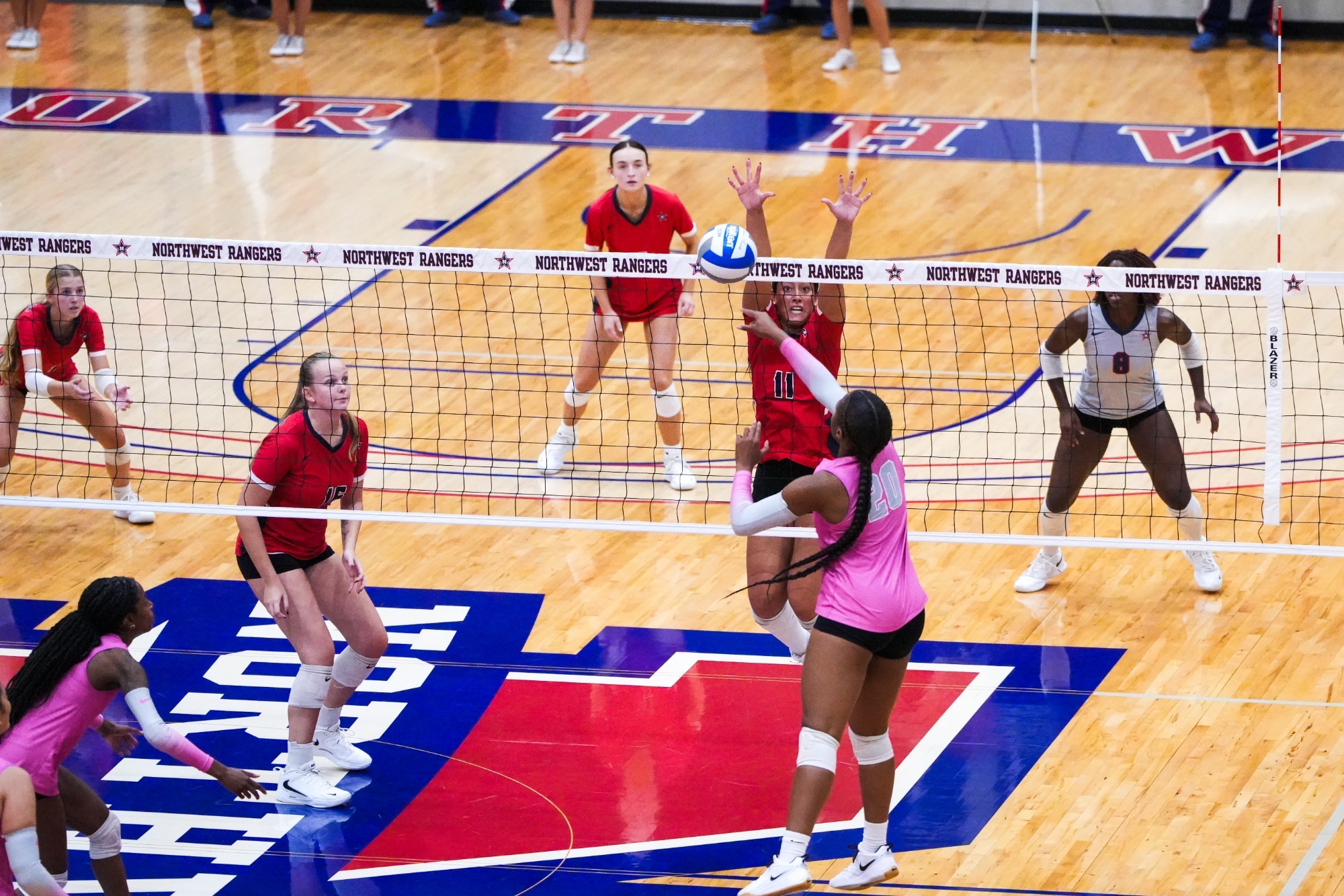 Garcia goes up for a block against Rust College
