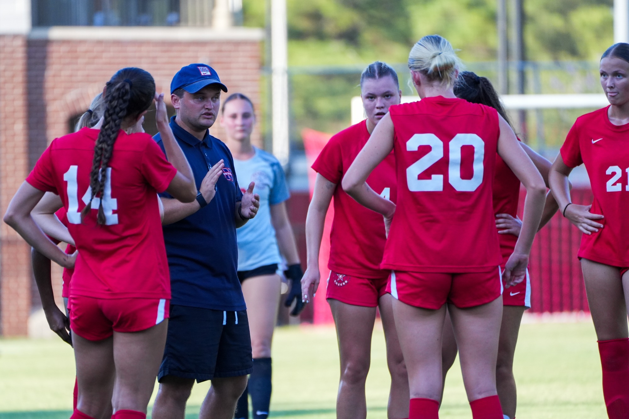 Coach James Beattie addresses his team against Co-Lin