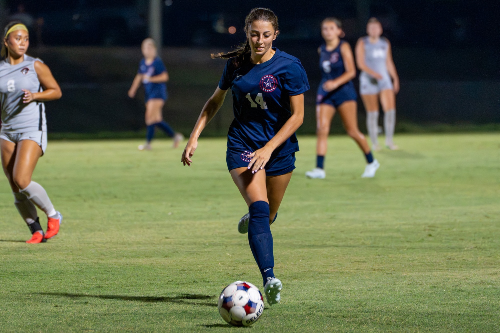 Maggie Pace dribbling the ball