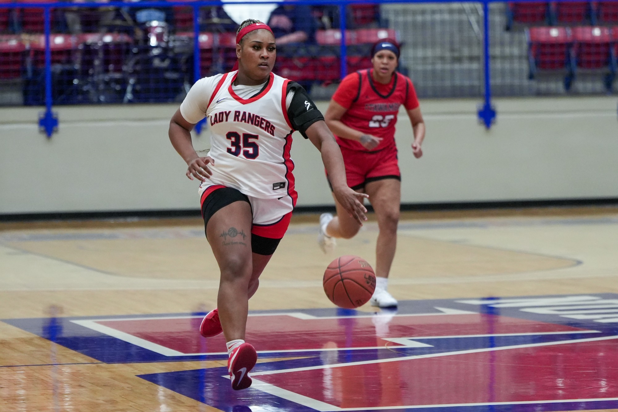 Story dribbles ball in game against ICC.