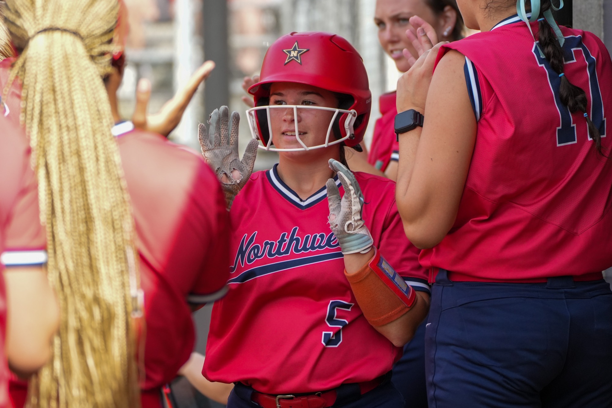 Rhoden gets high fives in the dugout 26