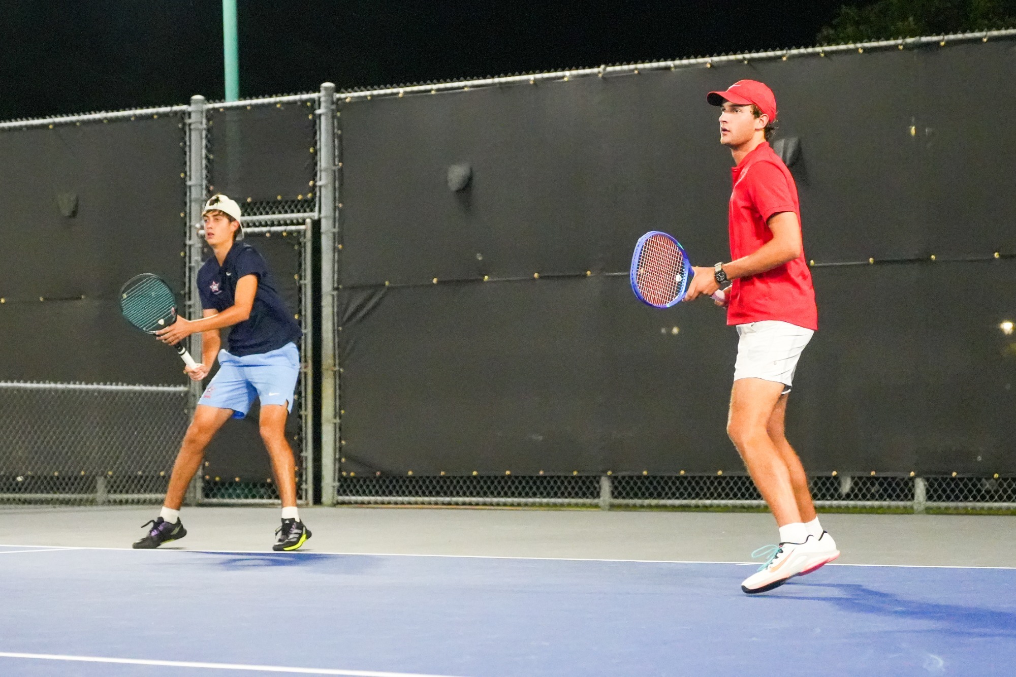 Miguel Lazaga Robayna and Brady Holliman prepare for service return at the NJCAA Men's Tennis Championships