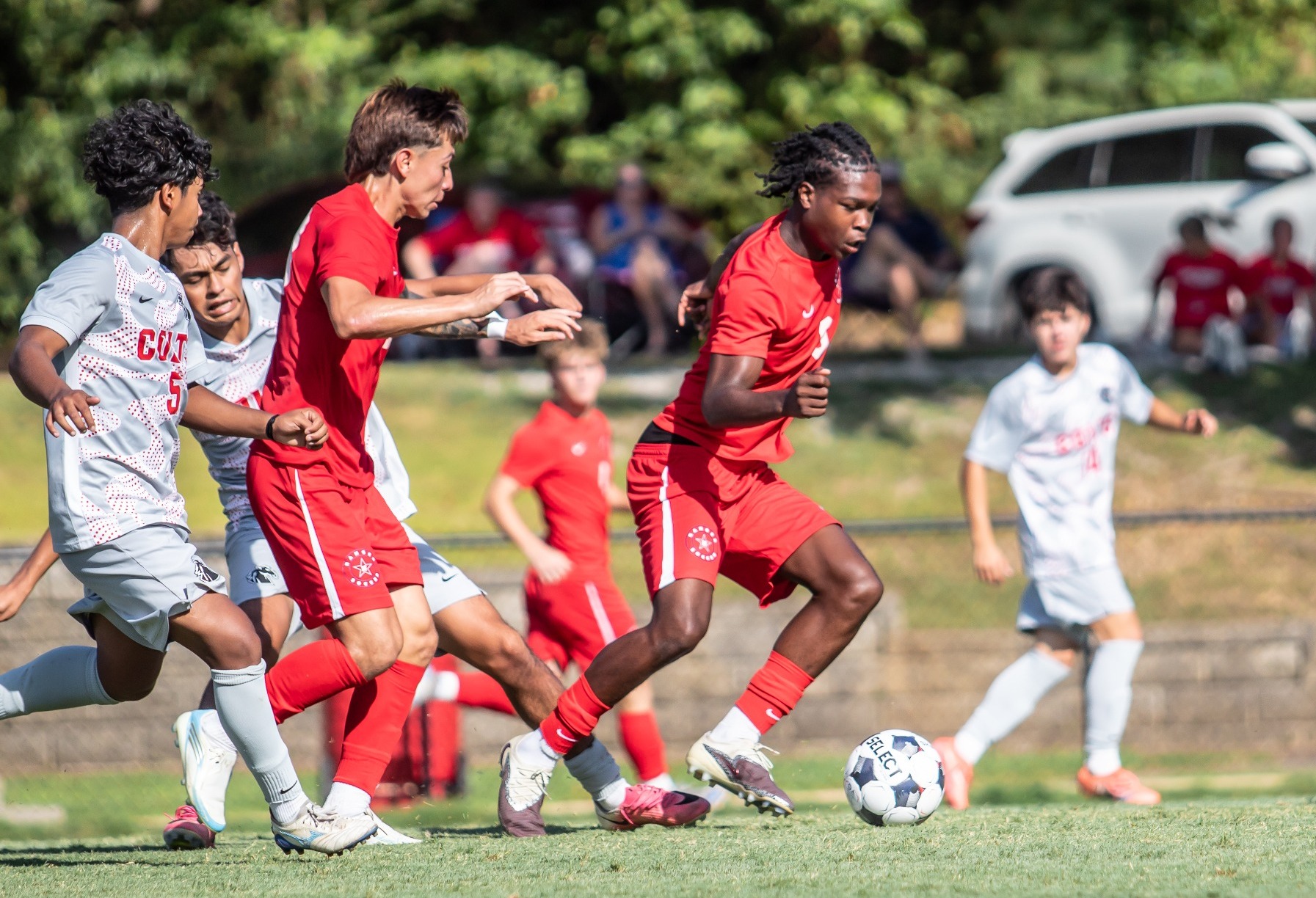 JB Owoyemi attacks with the ball against UA Cossatot
