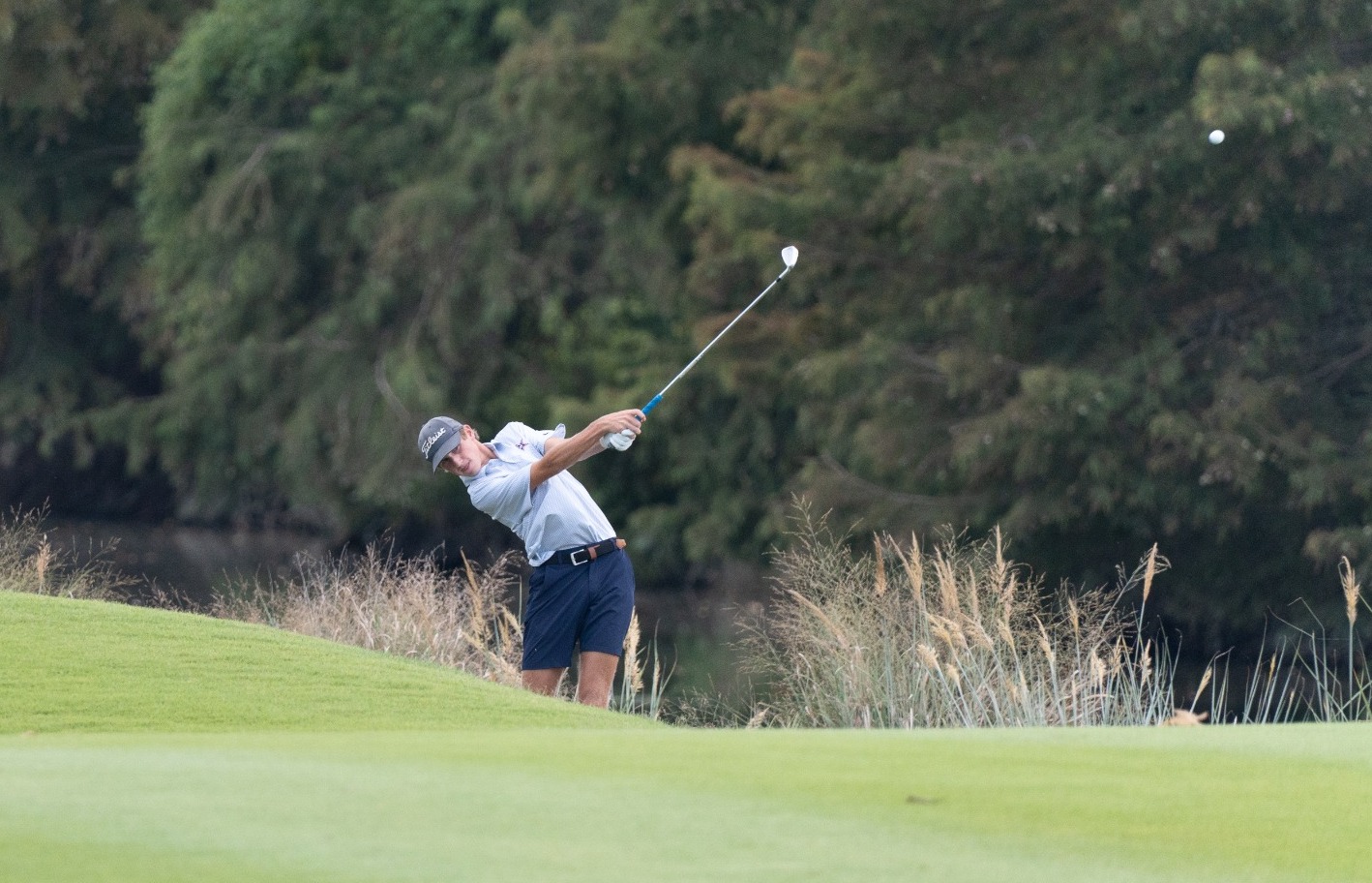 Cole Elander makes an approach shot at Tunica National
