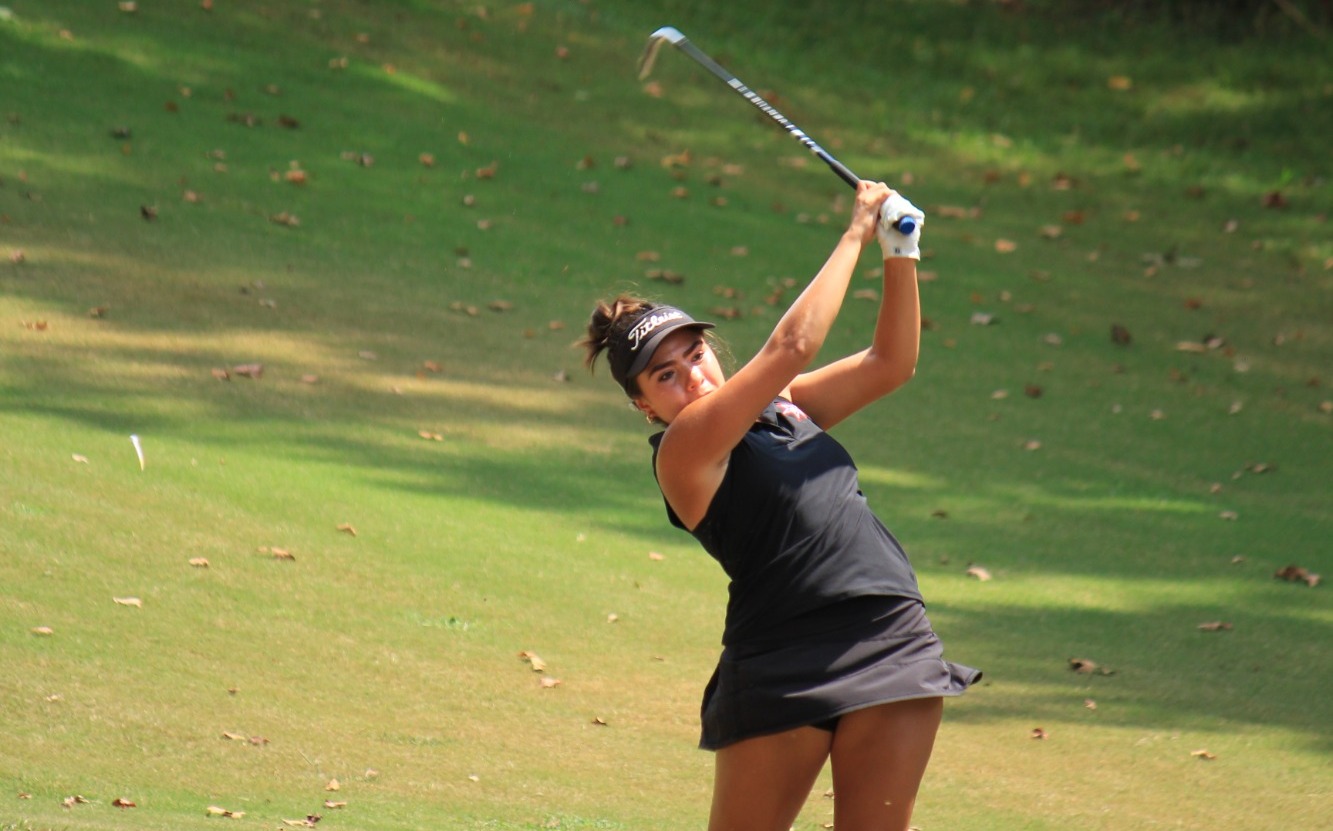 Castillo makes a shot on the golf course