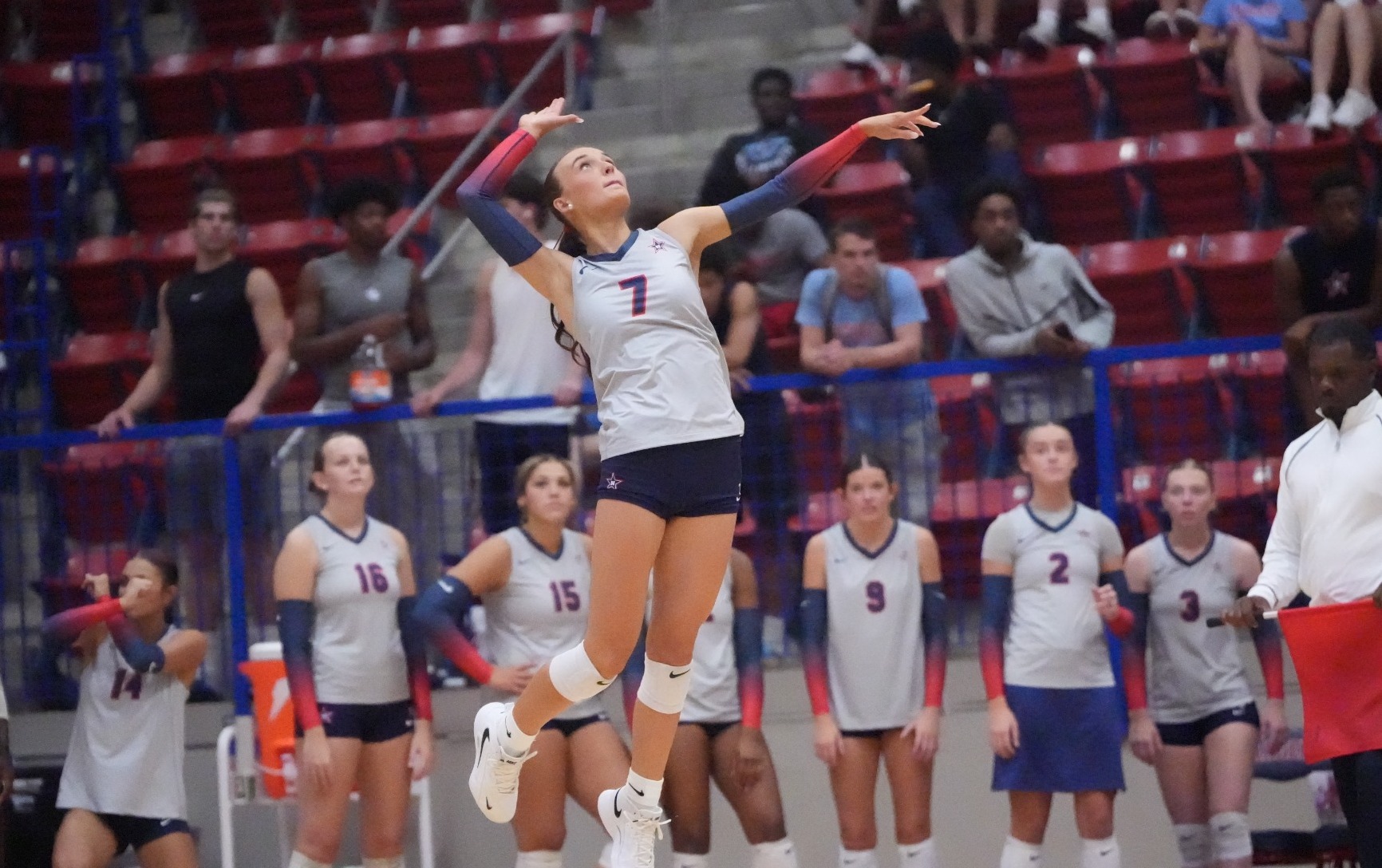Reese McIntosh serves against Jones College