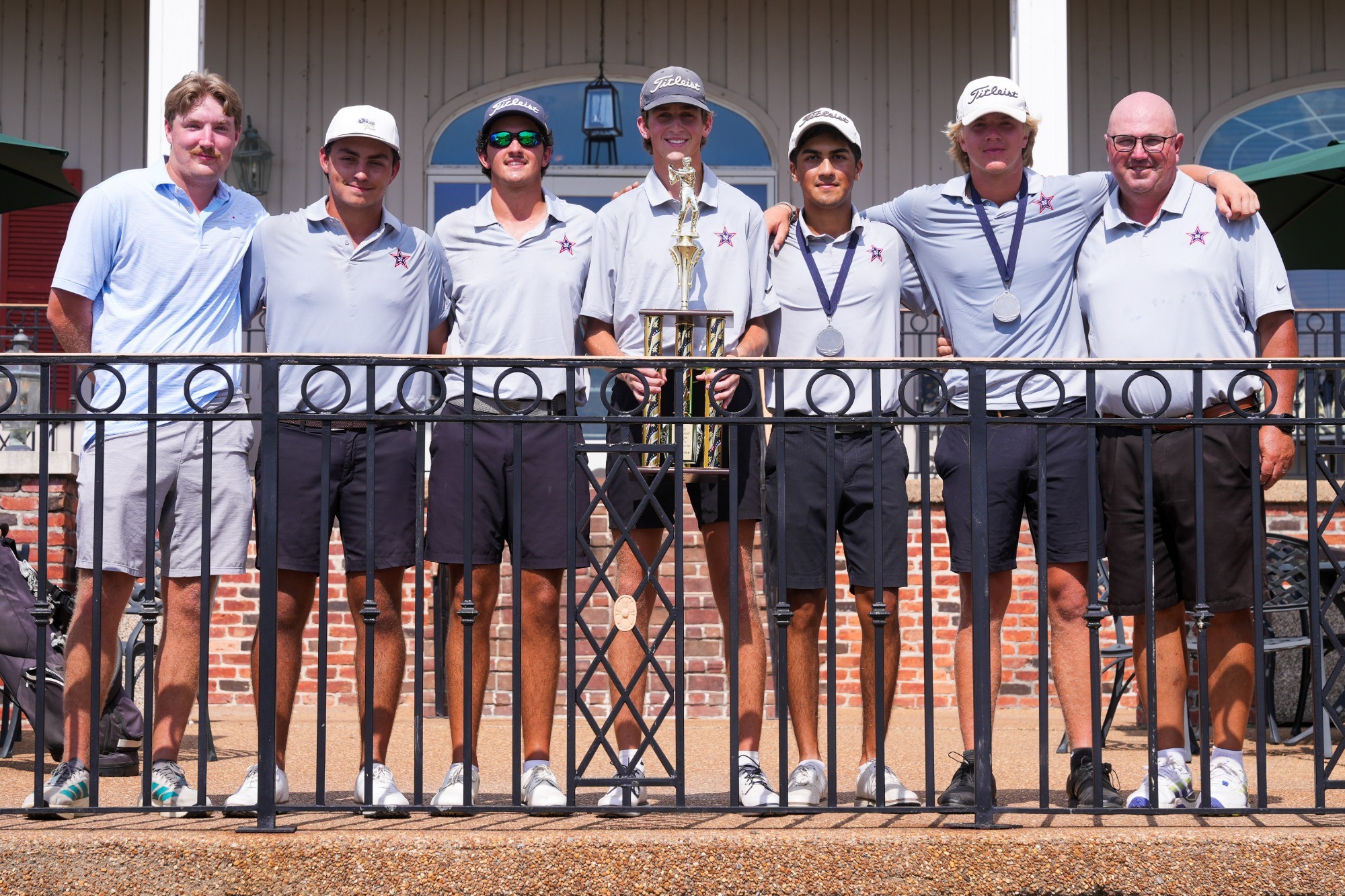 Northwest men's golf poses with championship trophy after winning the Ranger Men's Invitational