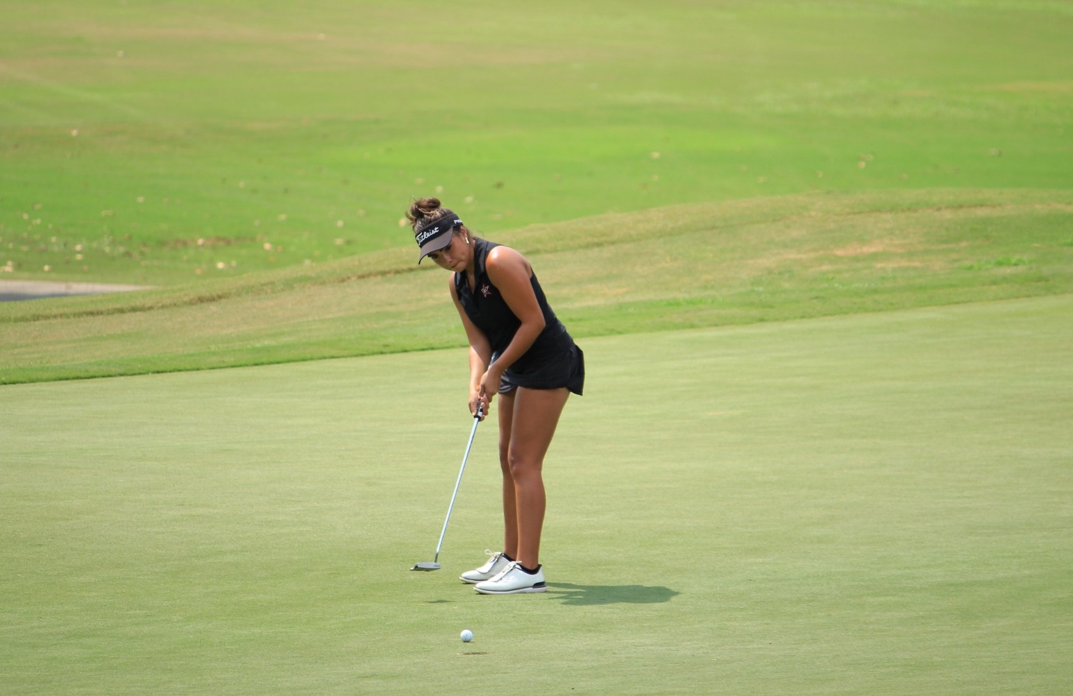 Elsa Lomas Castillo putts out during the Full Moon BBQ invitational